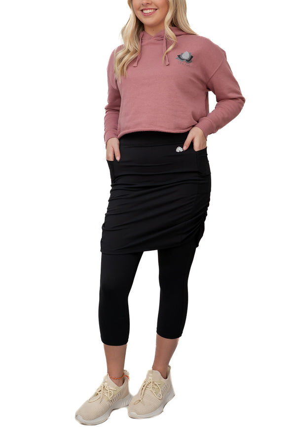Woman wearing Snoga Athletics modest activewear skirt leggings and cropped hoodie