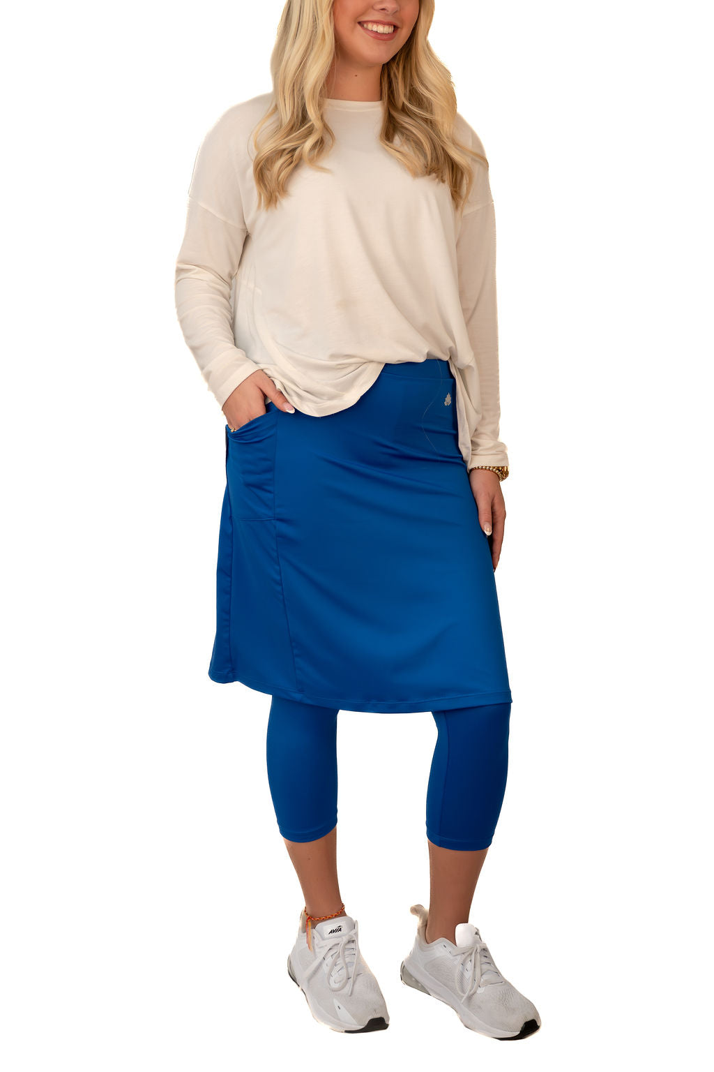 Snoga Athletics Fit Snoga 22-inch leggings in Iris Blue, shown on a model with a close-up of the fabric and fit.