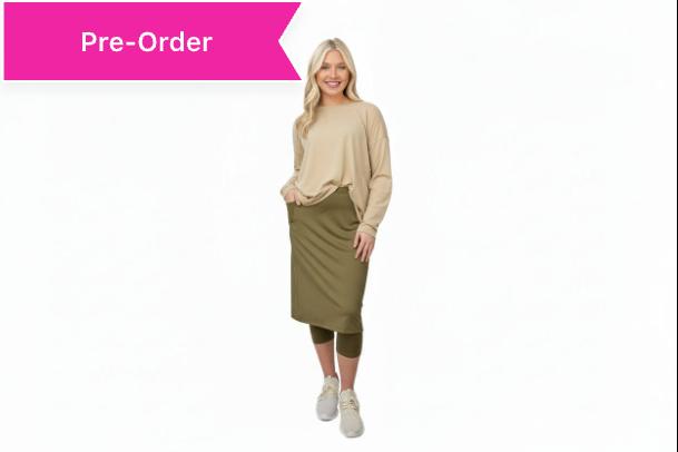 Woman wearing Snoga Athletics modest olive skirt with beige long sleeve top and leggings