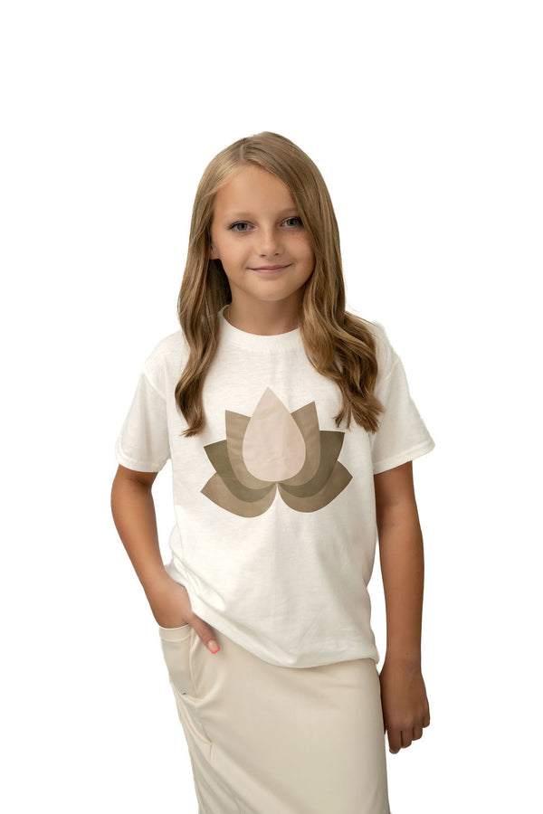 Girl in Snoga Athletics lotus graphic tee and modest cream skirt, studio background