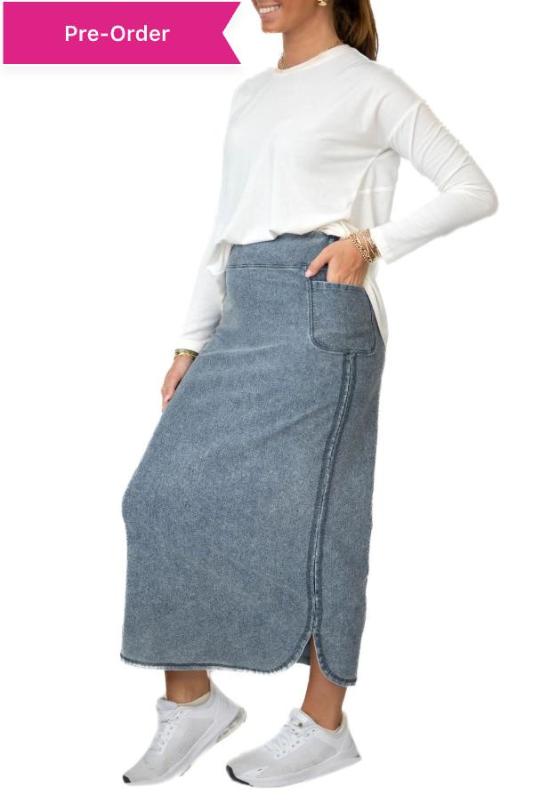 Snoga Athletics model in modest denim ankle-length skirt, white long sleeve top, and sneakers