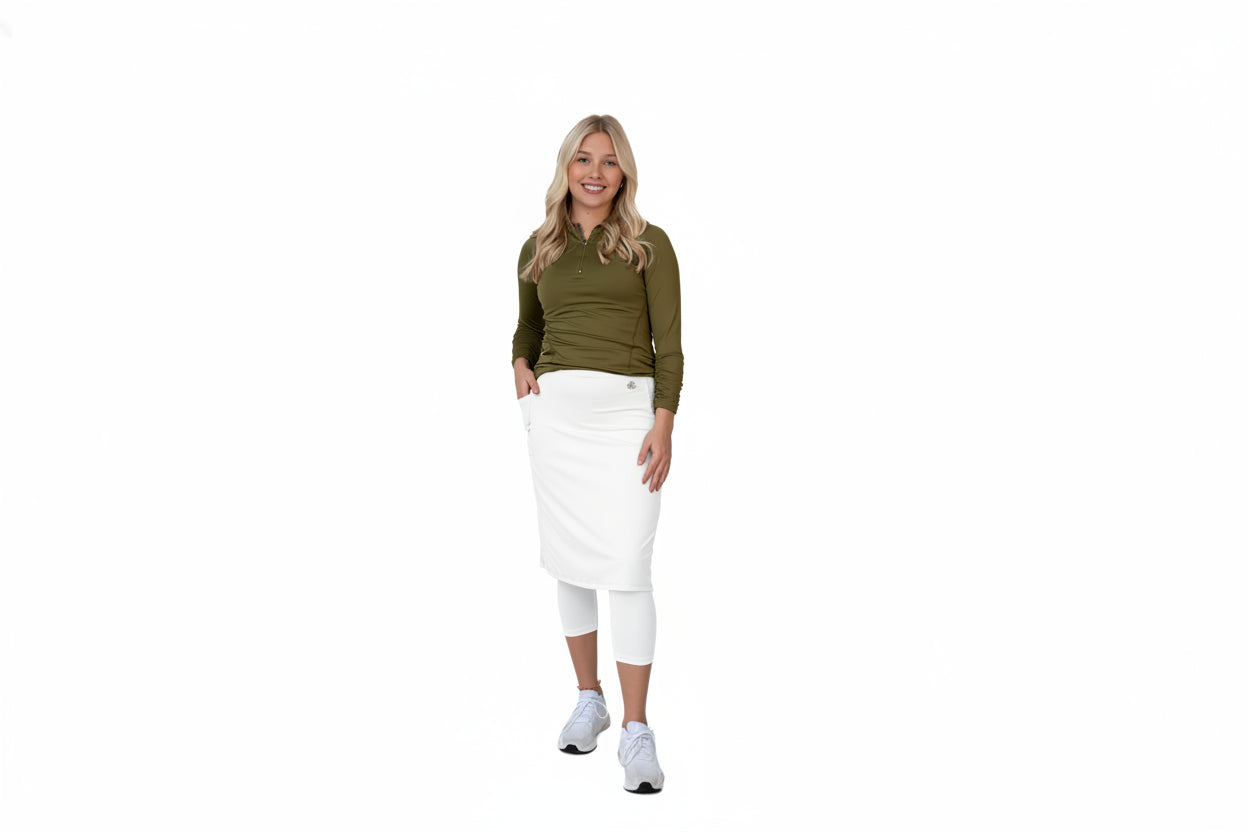 Woman in olive green modest activewear set with skirt and leggings by Snoga Athletics