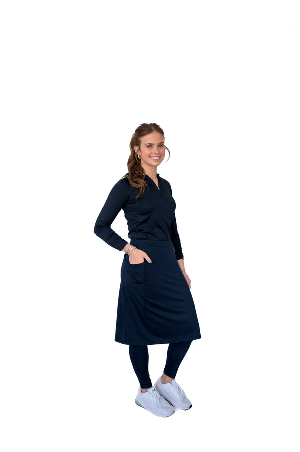Woman modeling Snoga Athletics modest activewear set with navy skirt leggings and long-sleeve top