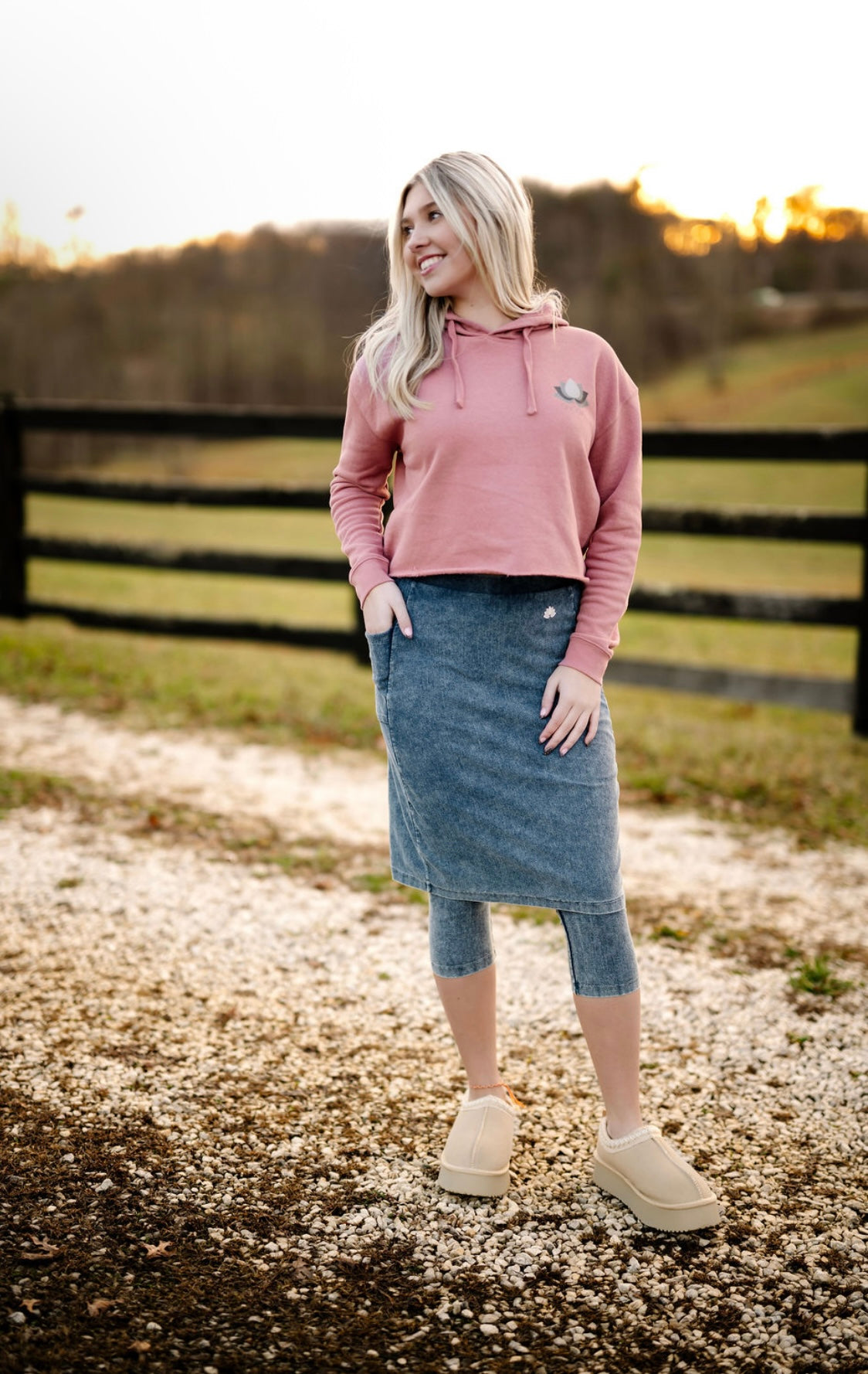 Woman outdoors wearing Snoga Athletics modest denim skirt leggings and pink hoodie