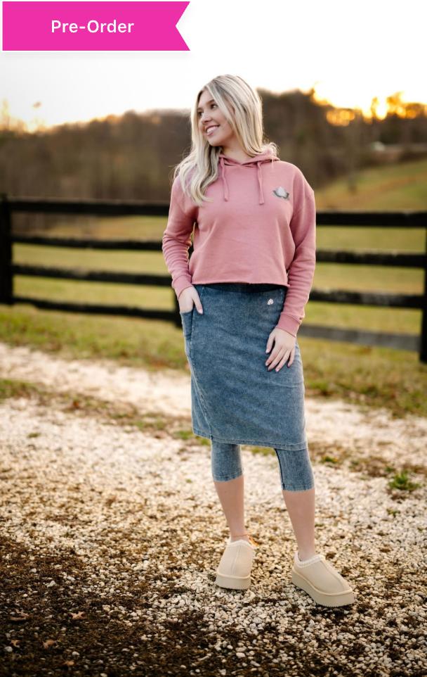 Woman outdoors wearing Snoga Athletics modest denim skirt leggings and pink hoodie