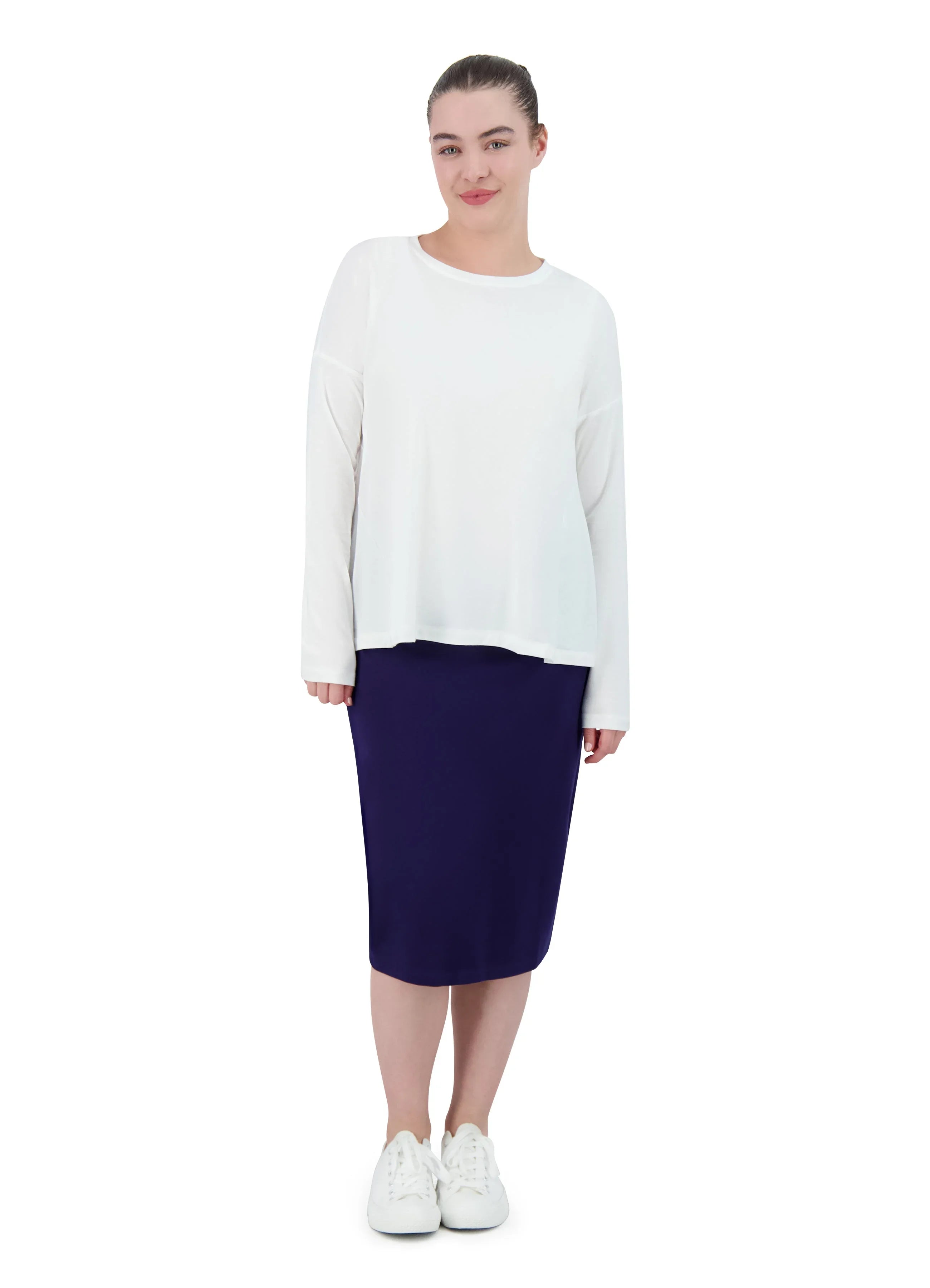 Woman wearing Snoga Athletics navy ponte pencil skirt and white long sleeve top