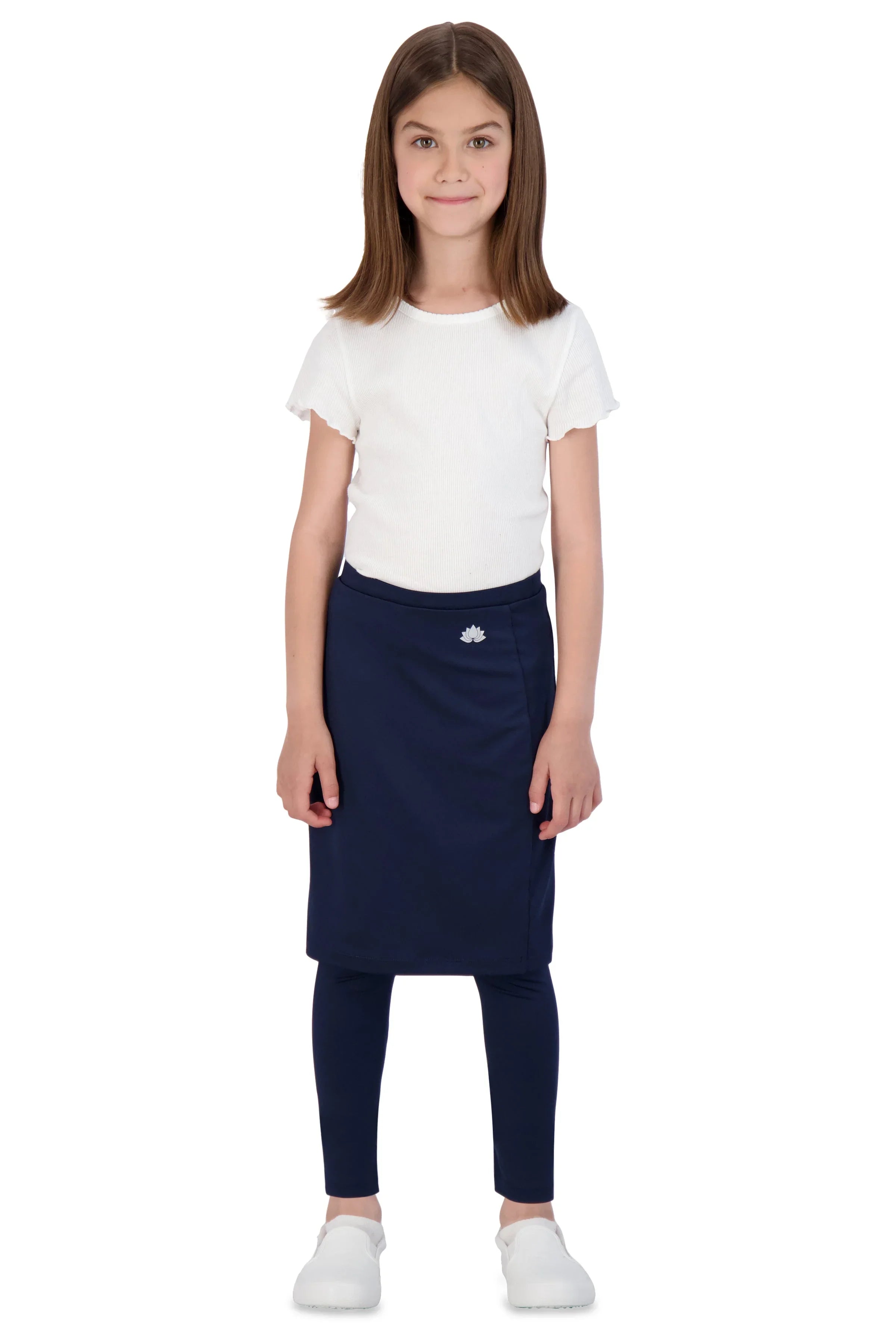 Girl wearing Snoga Athletics navy ankle-fit skirt leggings, white shirt, white shoes