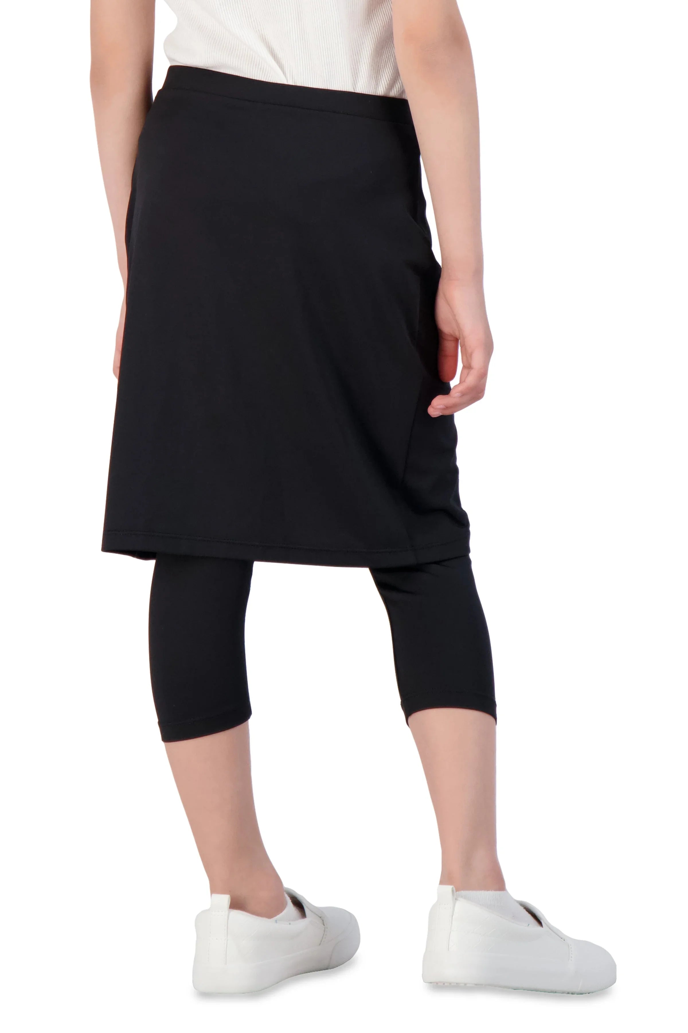 Girl wearing Snoga Athletics black faux wrap skirt with attached leggings