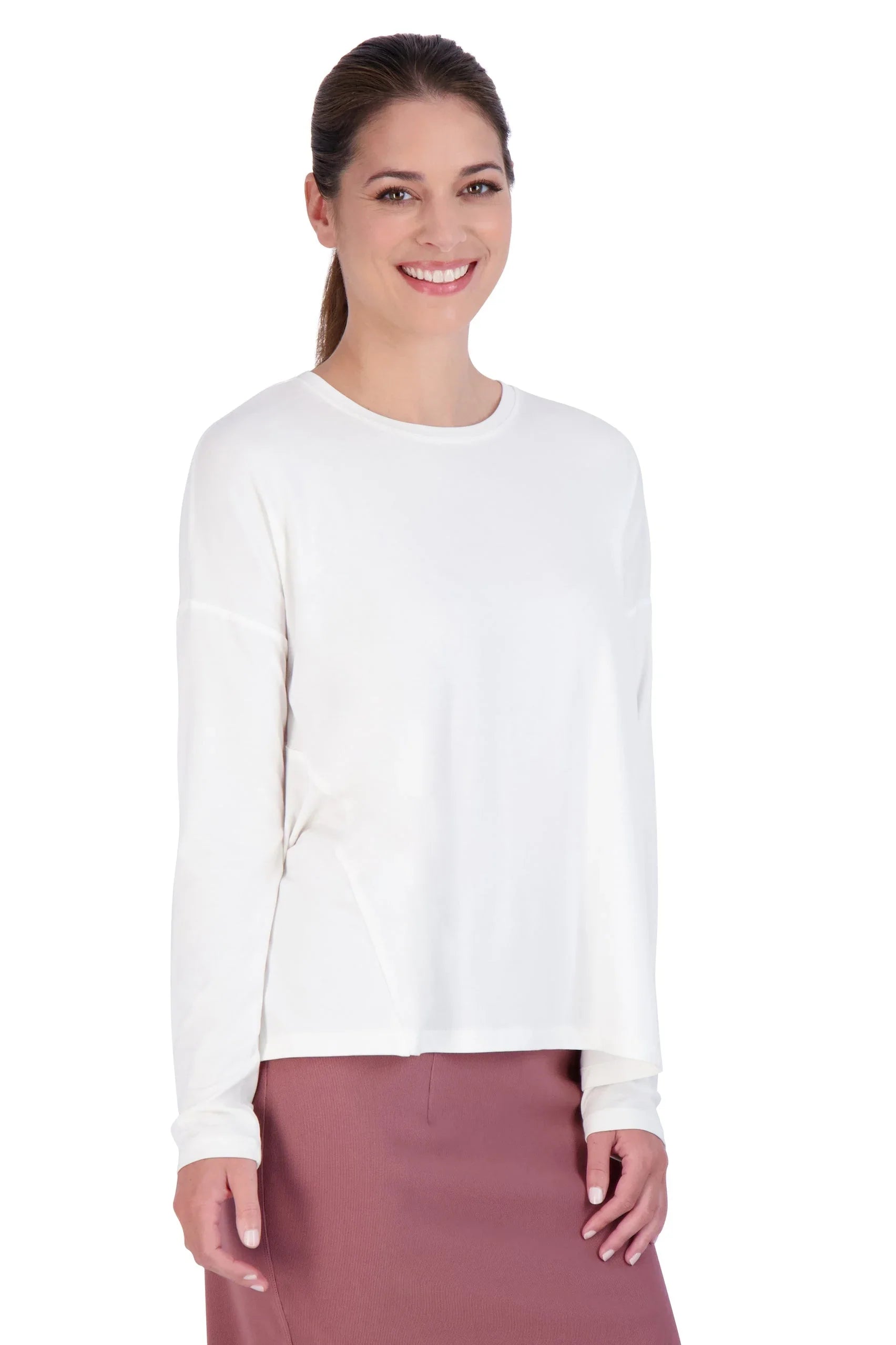 Woman wearing Snoga Athletics white long sleeve modest athletic tee and mauve skirt