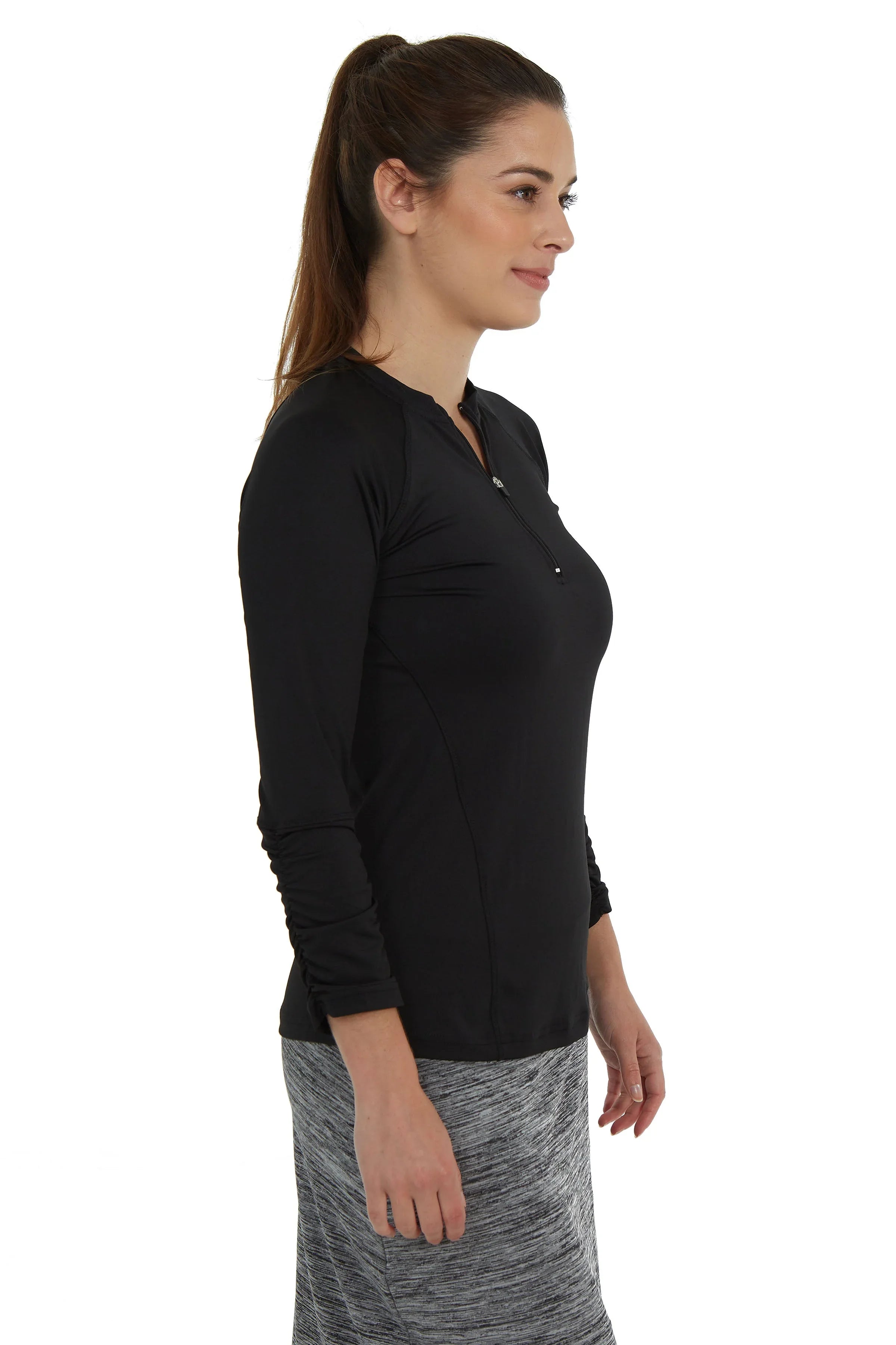 Woman wearing a black Snoga Athletics long sleeve active top with half-zip