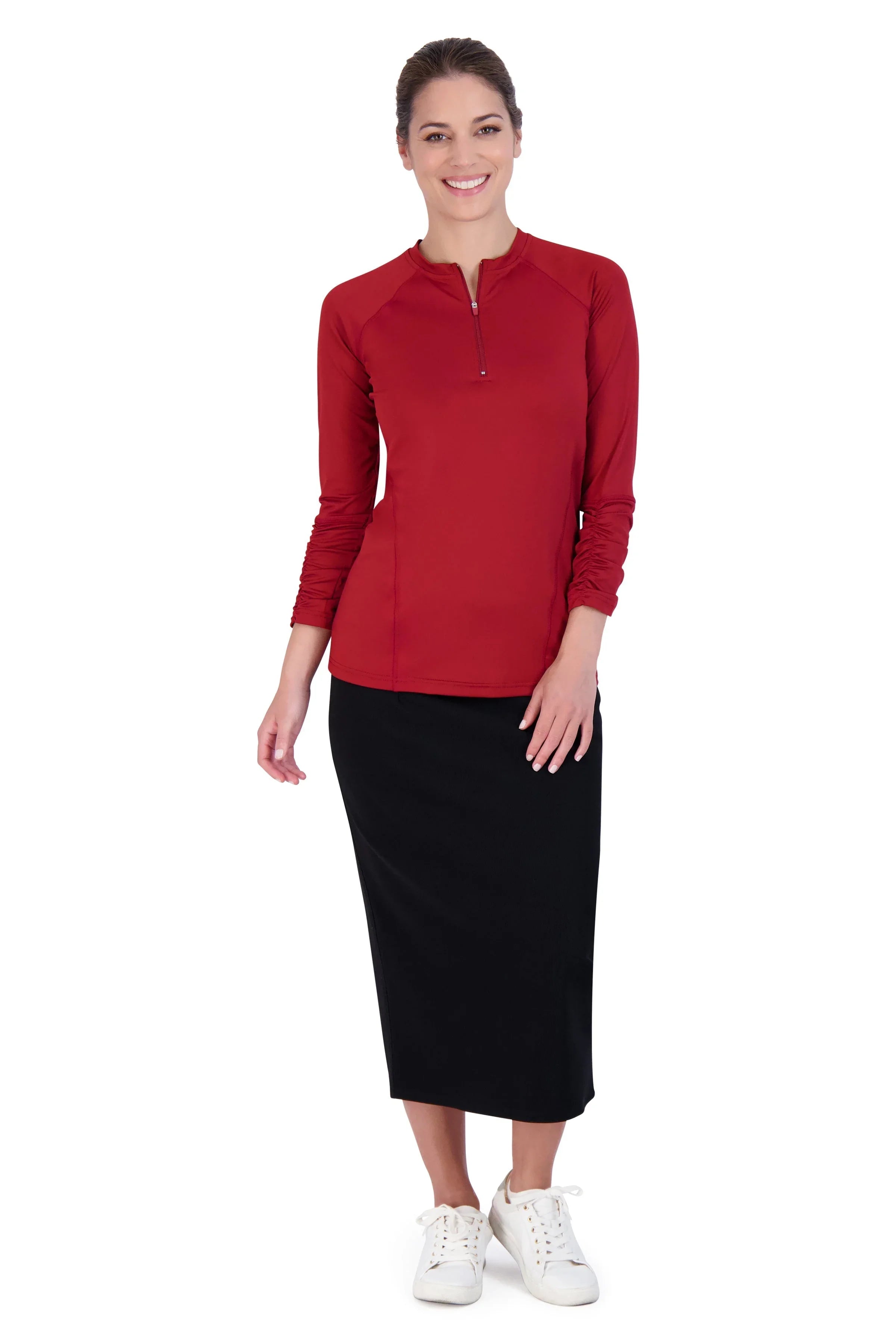 Woman wearing Snoga Athletics black pencil skirt and red long-sleeve top, standing and smiling