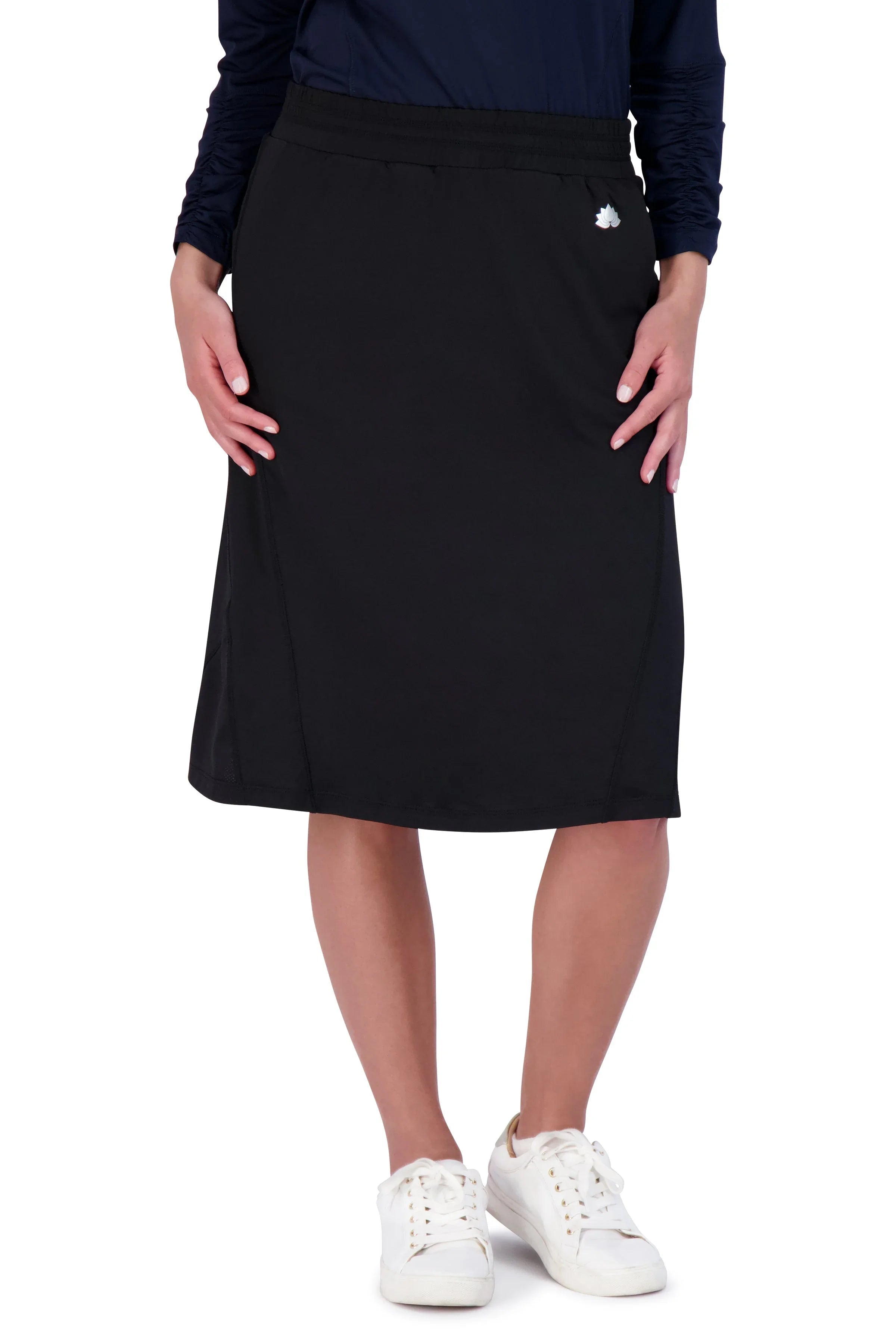 Woman wearing black knee-length travel skirt by Snoga Athletics