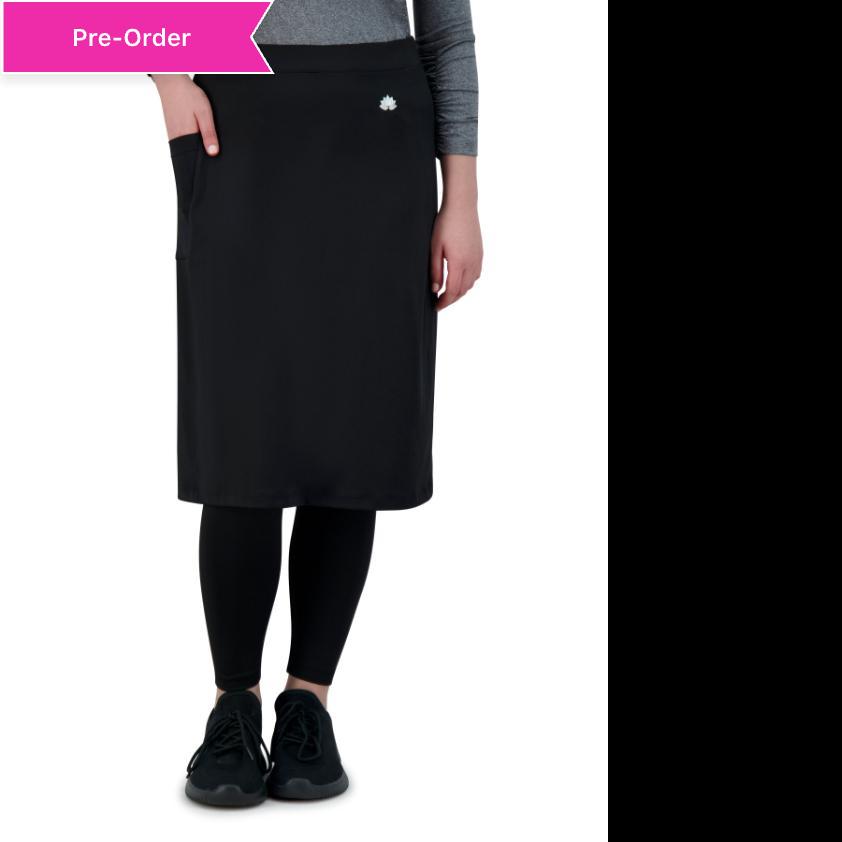 Woman wearing Snoga Athletics black ankle-length skirt with leggings and sneakers.