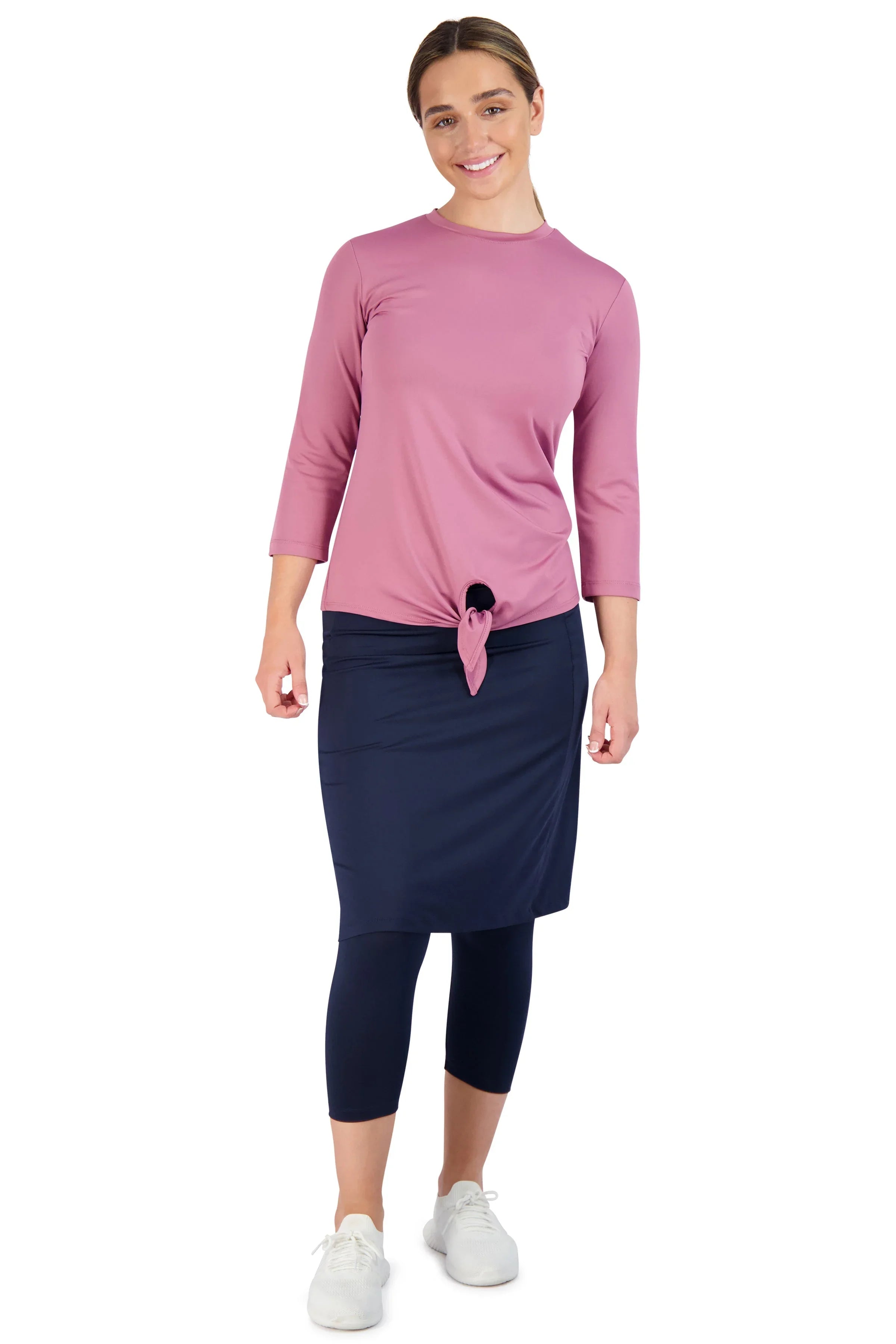 Snoga Athletics modest activewear in navy skirted leggings and pink top