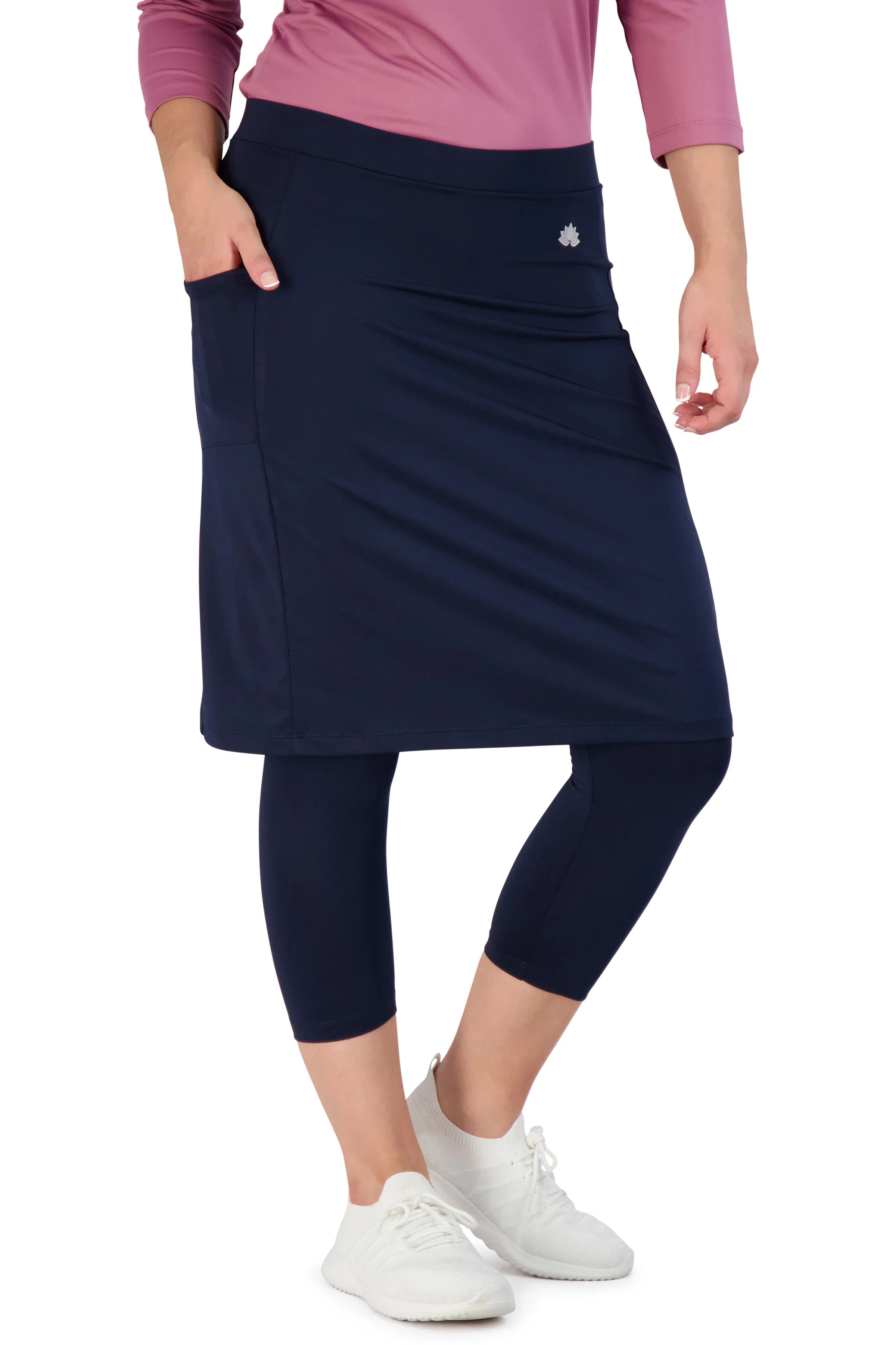 Snoga Athletics navy athletic skirt with attached leggings, side pocket, and logo detail