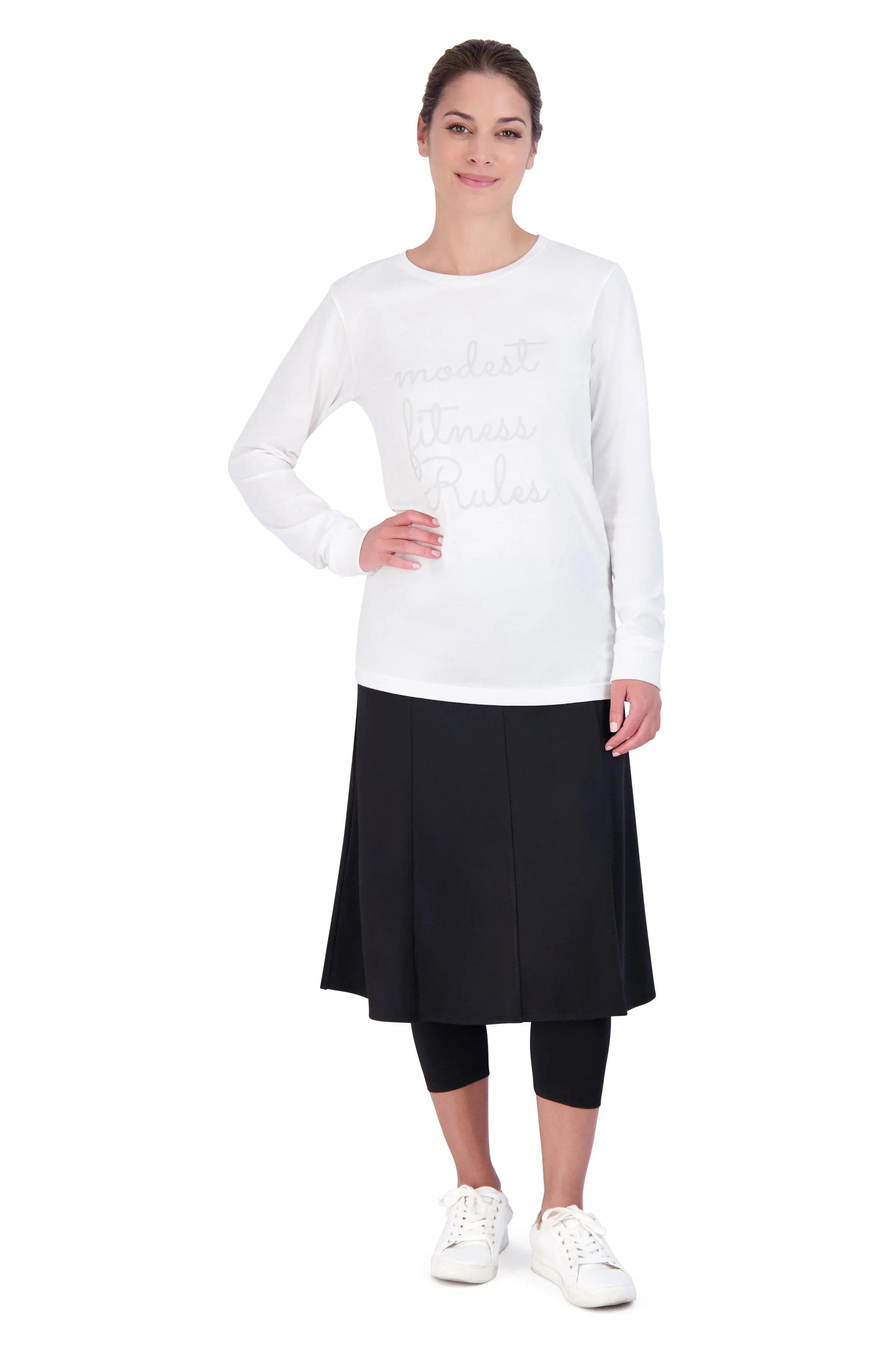 Woman modeling Snoga Athletics black modest ballet skirt with attached leggings and white top