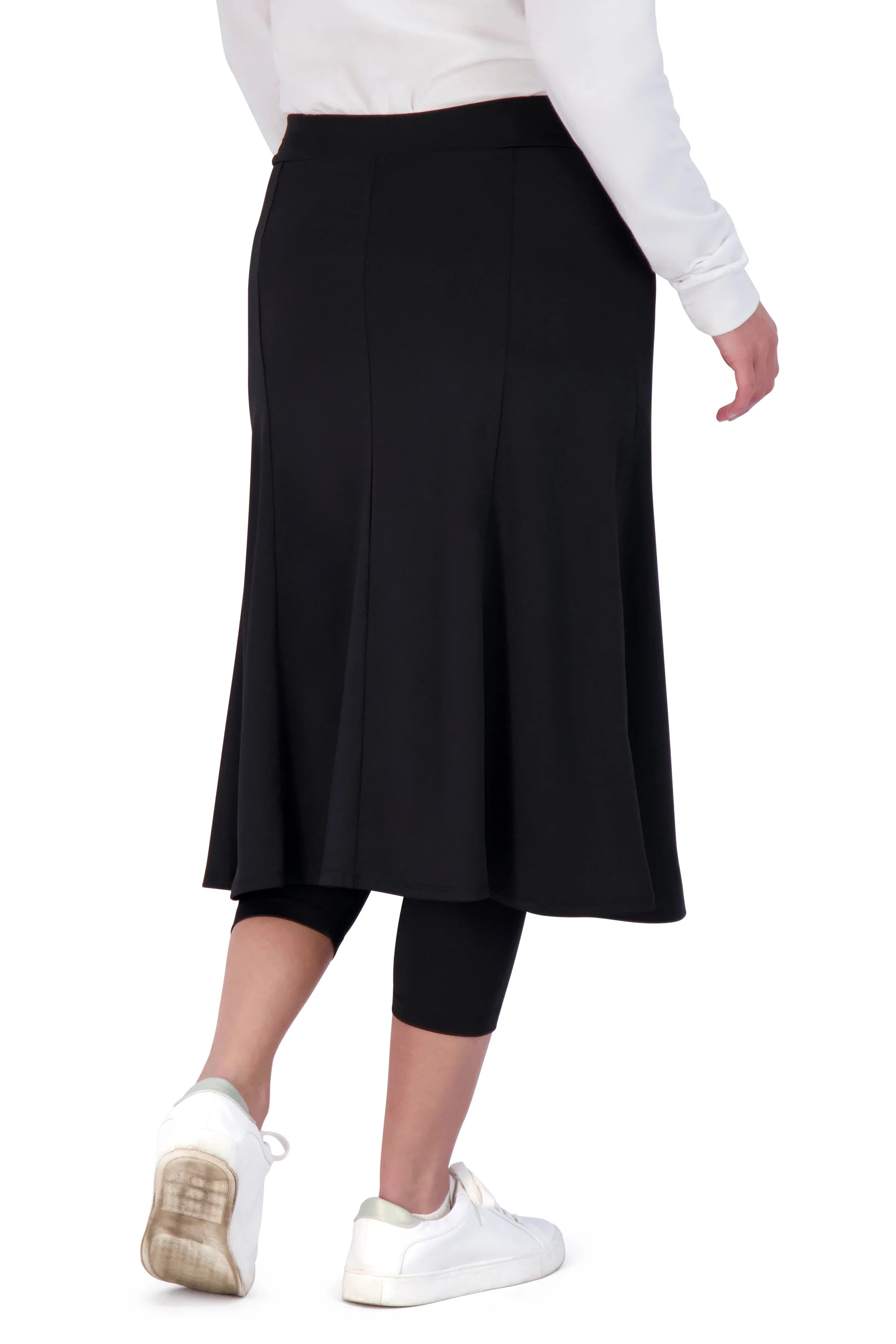 Snoga Athletics black ballet skirt with attached leggings, side view on model