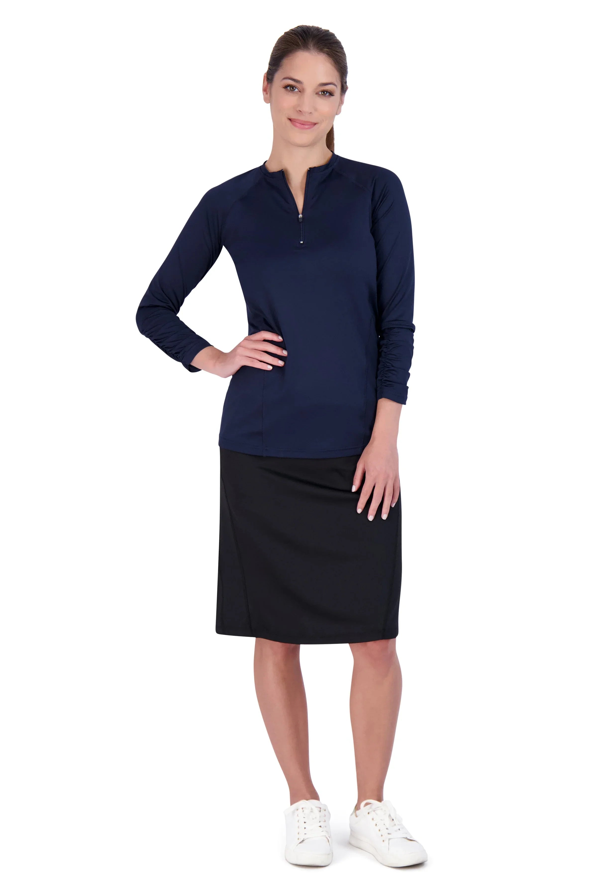 Woman wearing black Snoga Athletics travel skirt and navy long sleeve top, white background