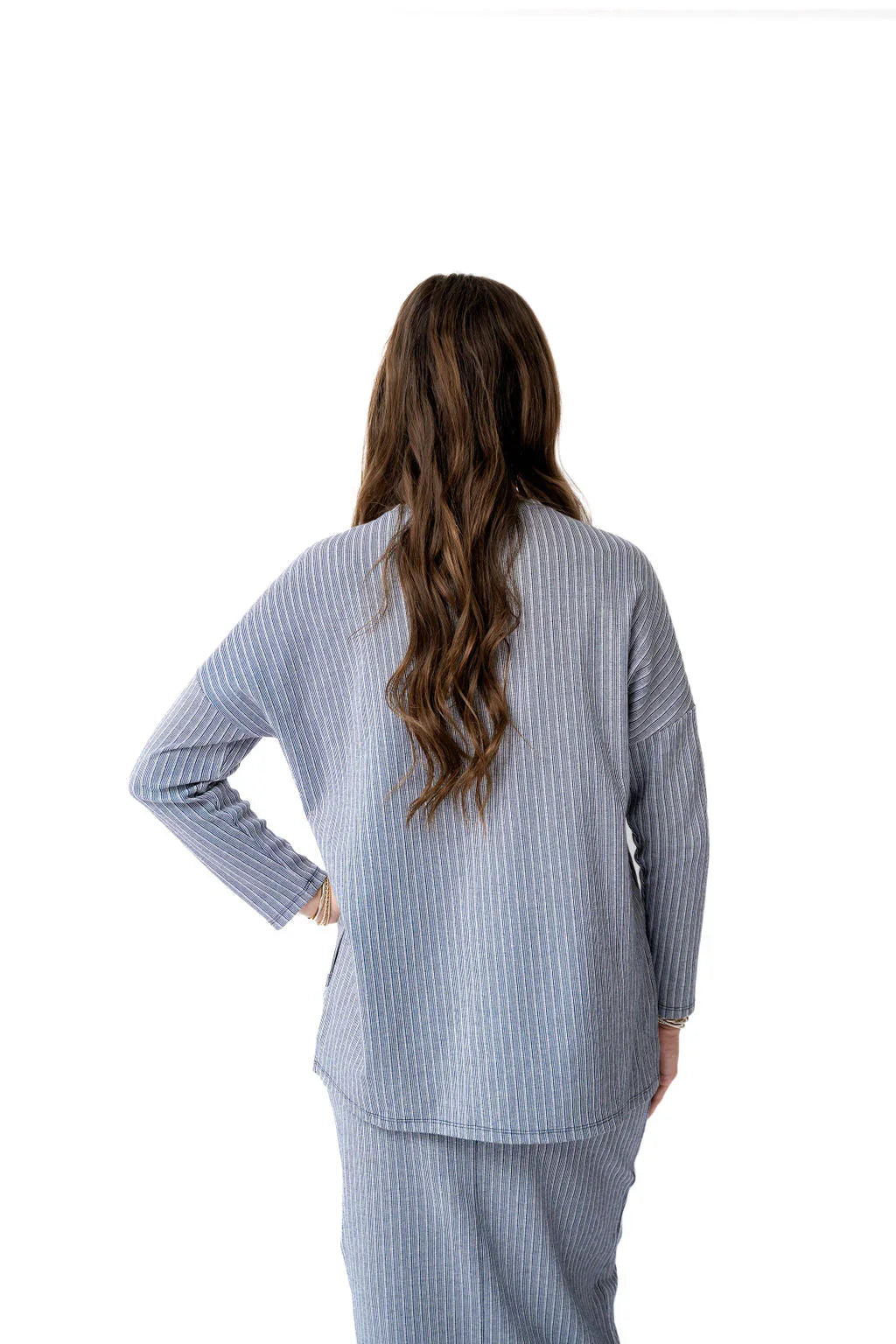 Back view of Snoga Athletics blue striped knit top with long sleeves, modest activewear