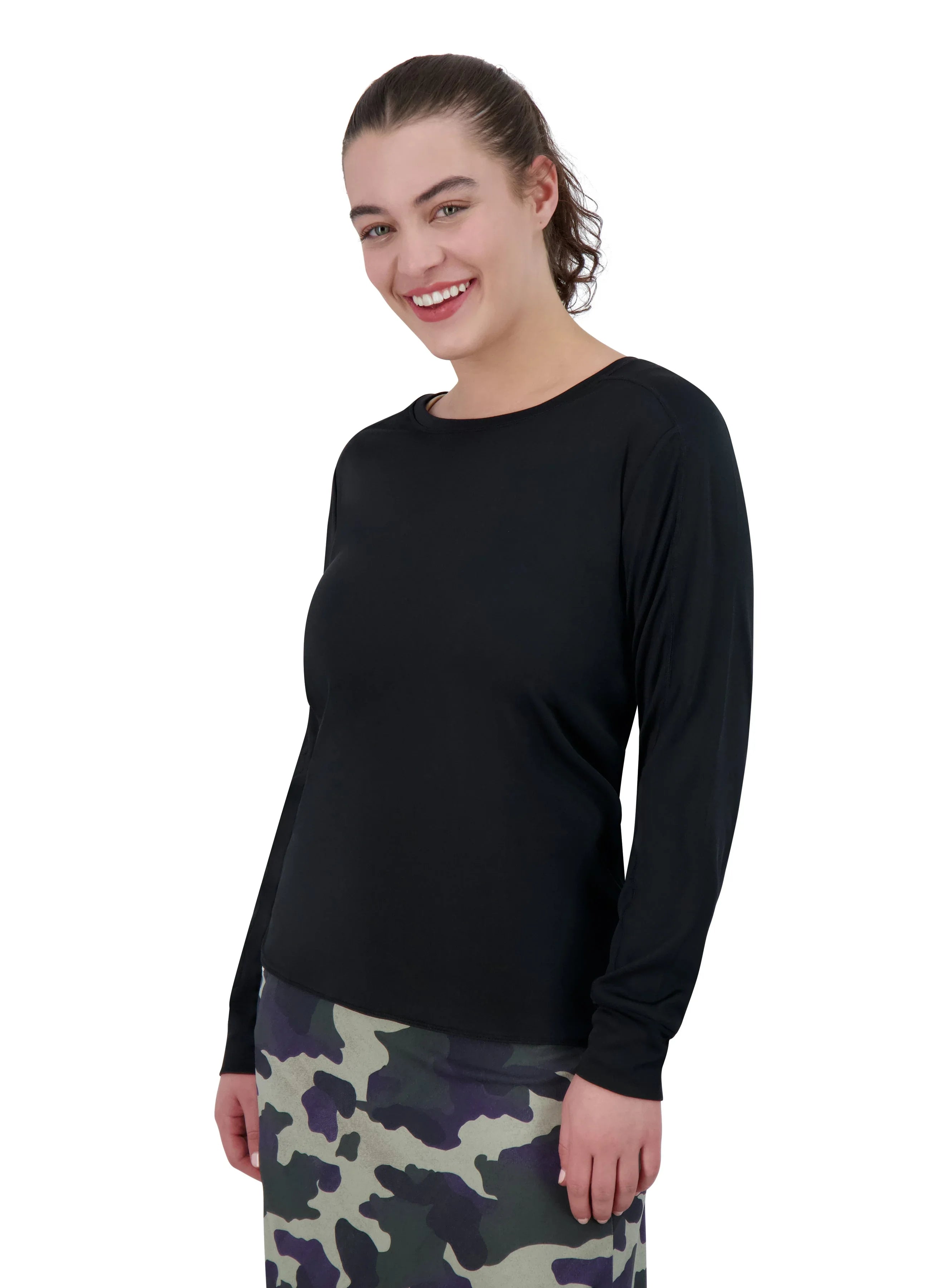 Woman wearing Snoga Athletics black long sleeve active top and camo skirt