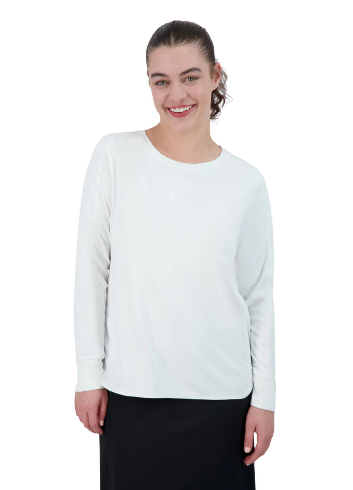 Woman wearing white long sleeve active top and black skirt from Snoga Athletics
