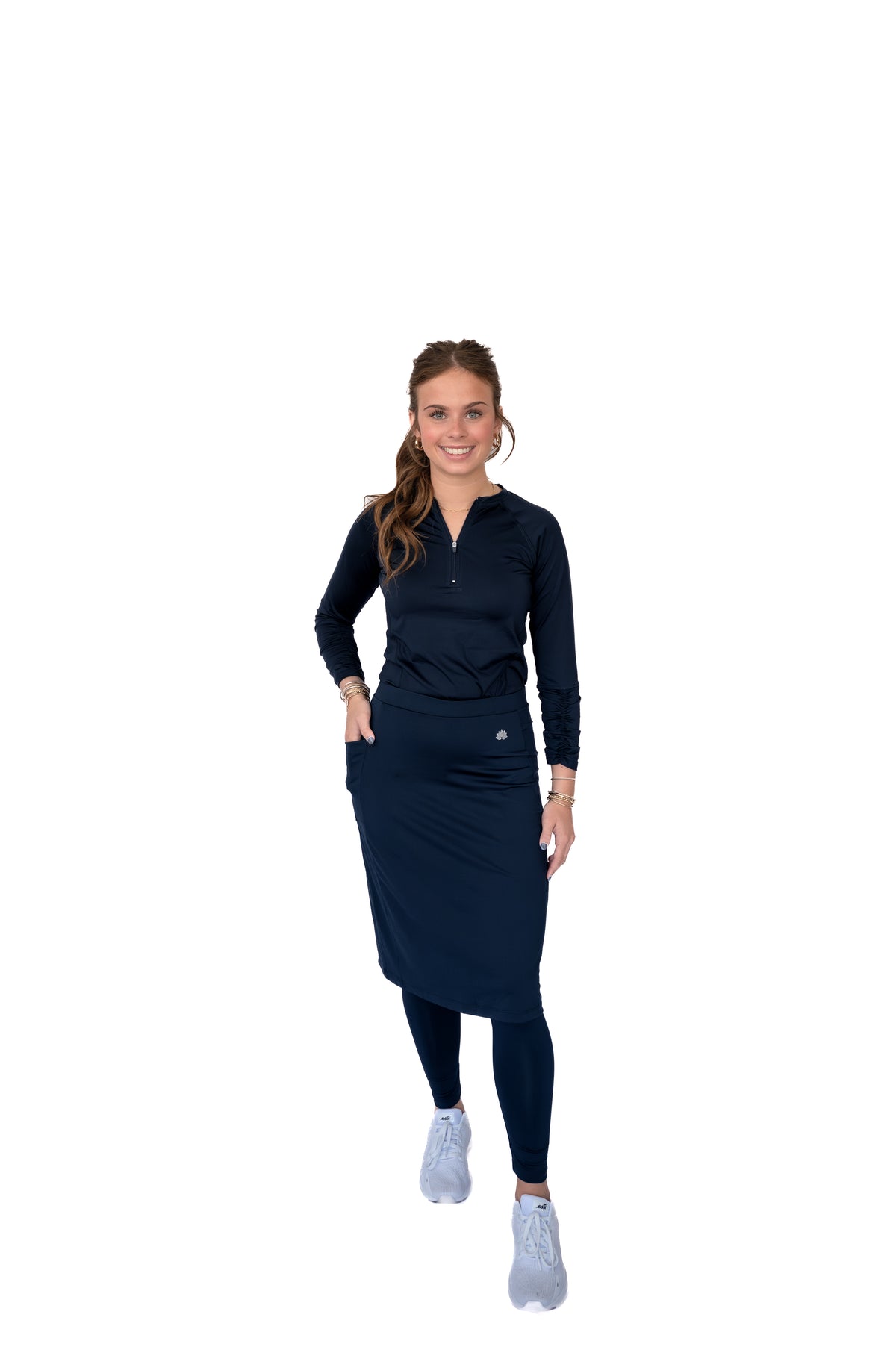 Woman wearing navy modest activewear skirt leggings set by Snoga Athletics