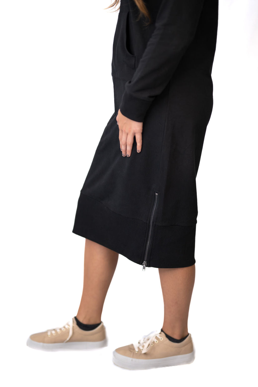 Snoga Athletics black modest activewear skirt with side zipper detail, styled with sneakers