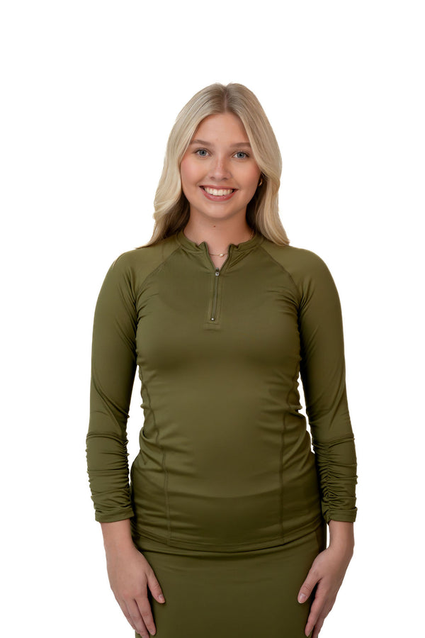 Woman modeling olive green long sleeve zip top by Snoga Athletics, modest activewear
