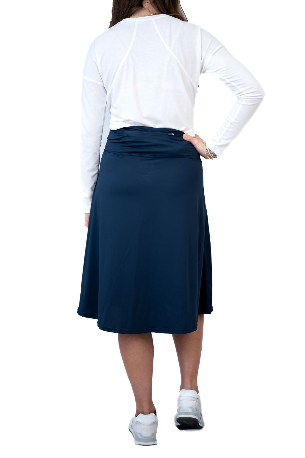 Snoga Athletics navy modest activewear skirt, back view, paired with white long sleeve top