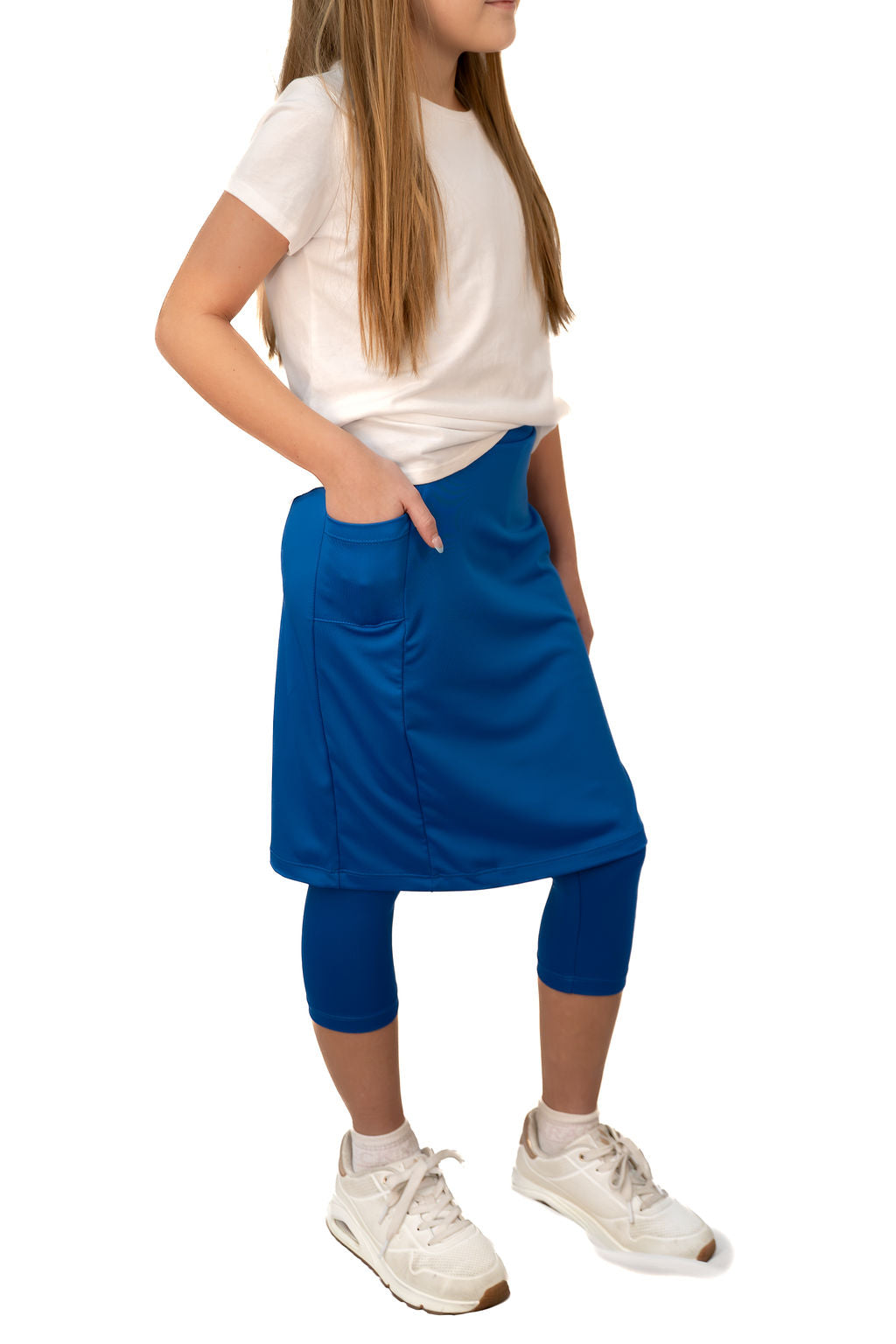 Girl in white shirt and blue Snoga Athletics modest skirt leggings with pockets