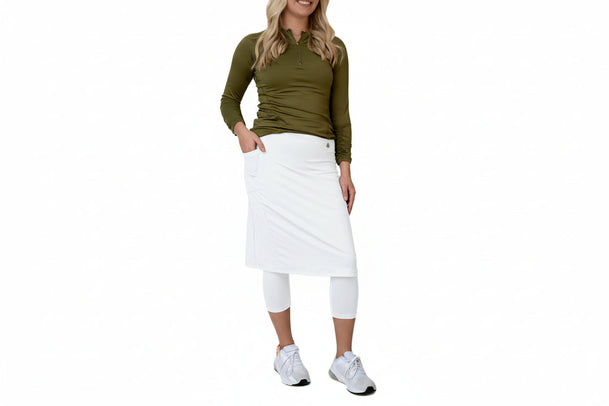 Woman models olive green modest activewear skirt with leggings by Snoga Athletics