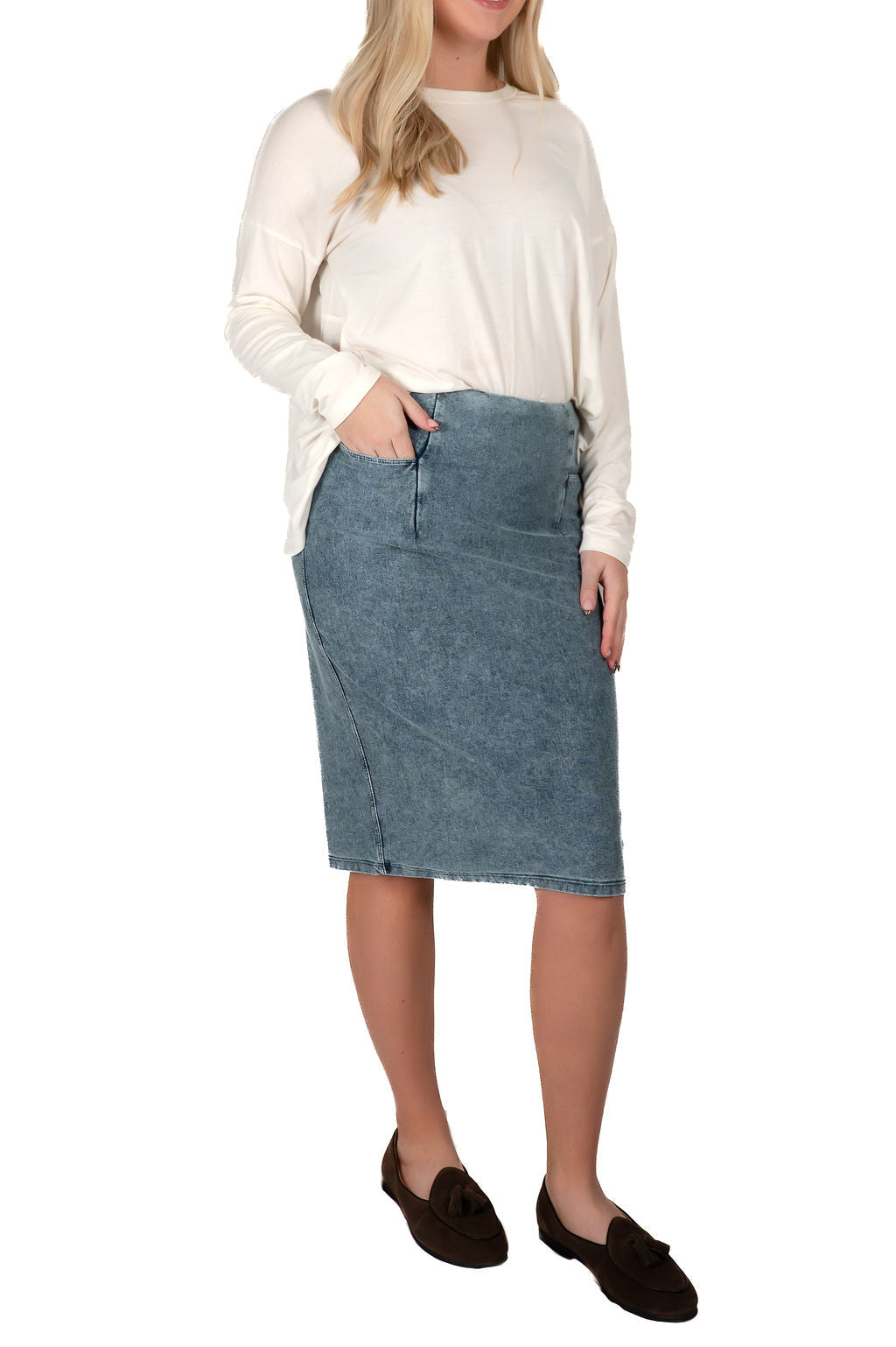 Woman wearing a long sleeve top and modest denim skirt from Snoga Athletics