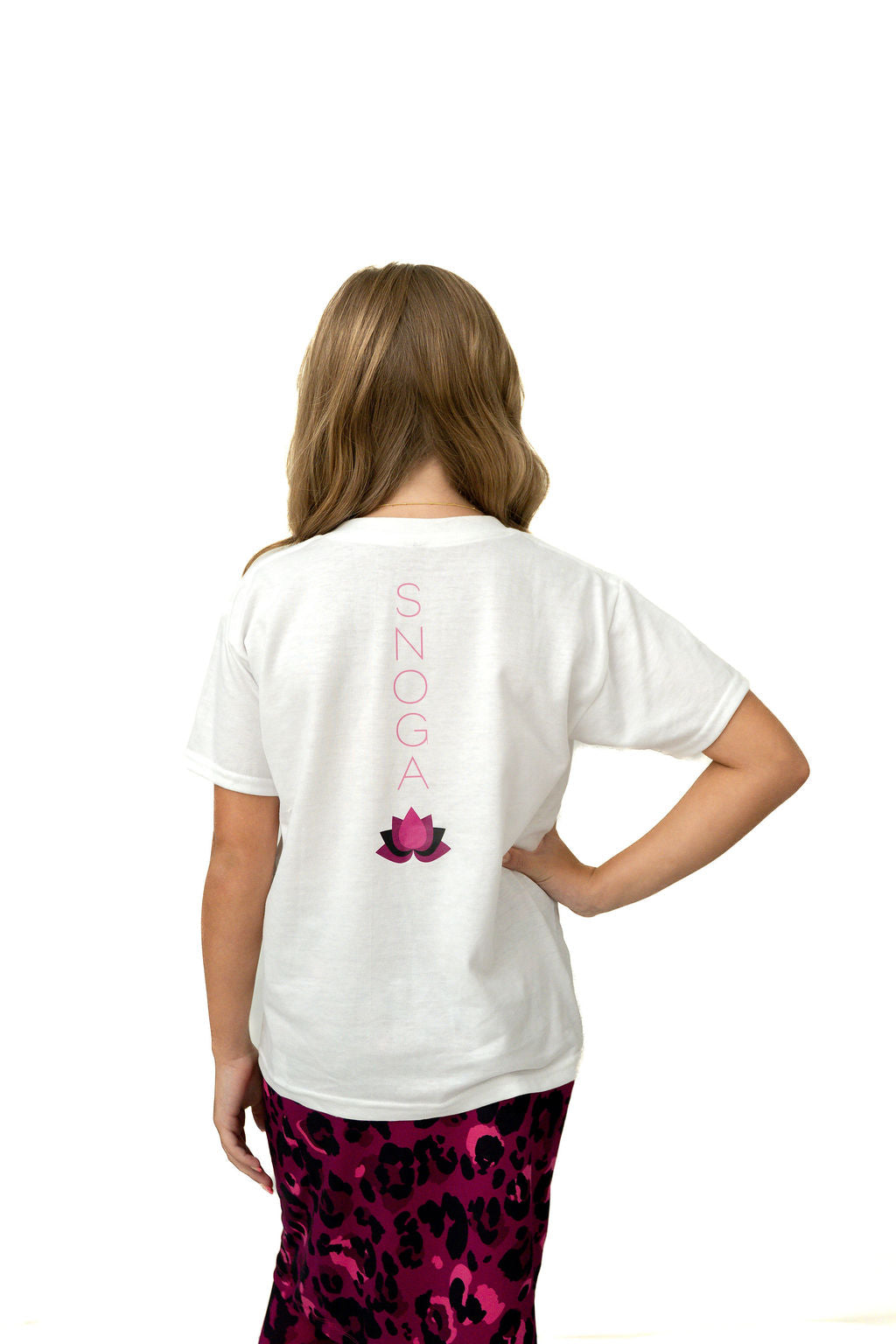 Girl in Snoga Athletics t-shirt with logo and pink leopard print skirt, back view