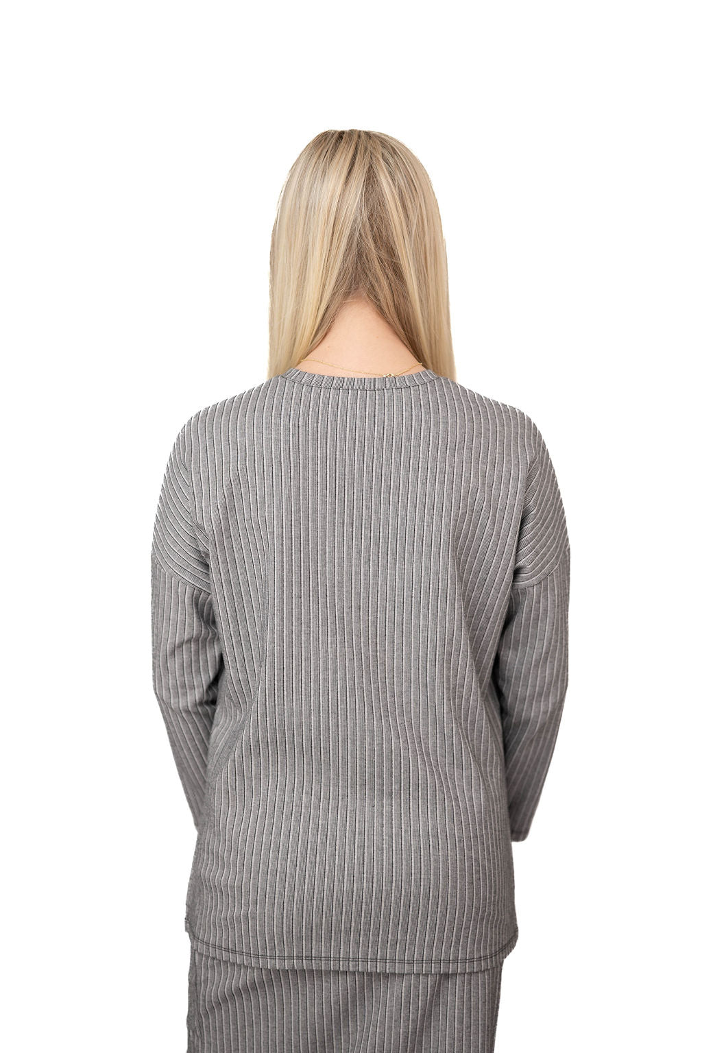 Snoga Athletics gray pinstripe long sleeve top shown from the back on model