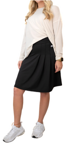 Snoga Athletics side pleat skort featuring a flowy design, elastic waistband, and lightweight fabric for active wear and casual outfits.