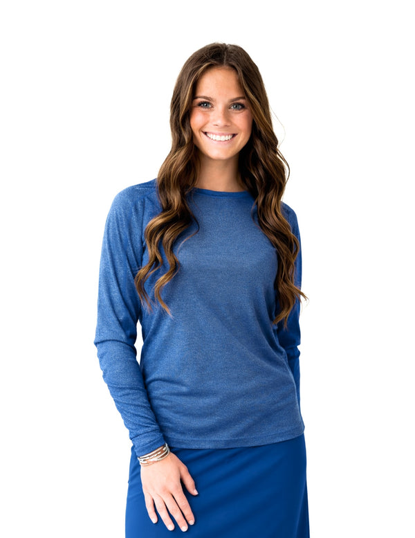 Woman modeling blue long sleeve activewear top and skirt by Snoga Athletics