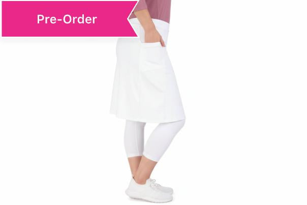 Woman wearing Snoga Athletics blue modest skirt leggings and white top