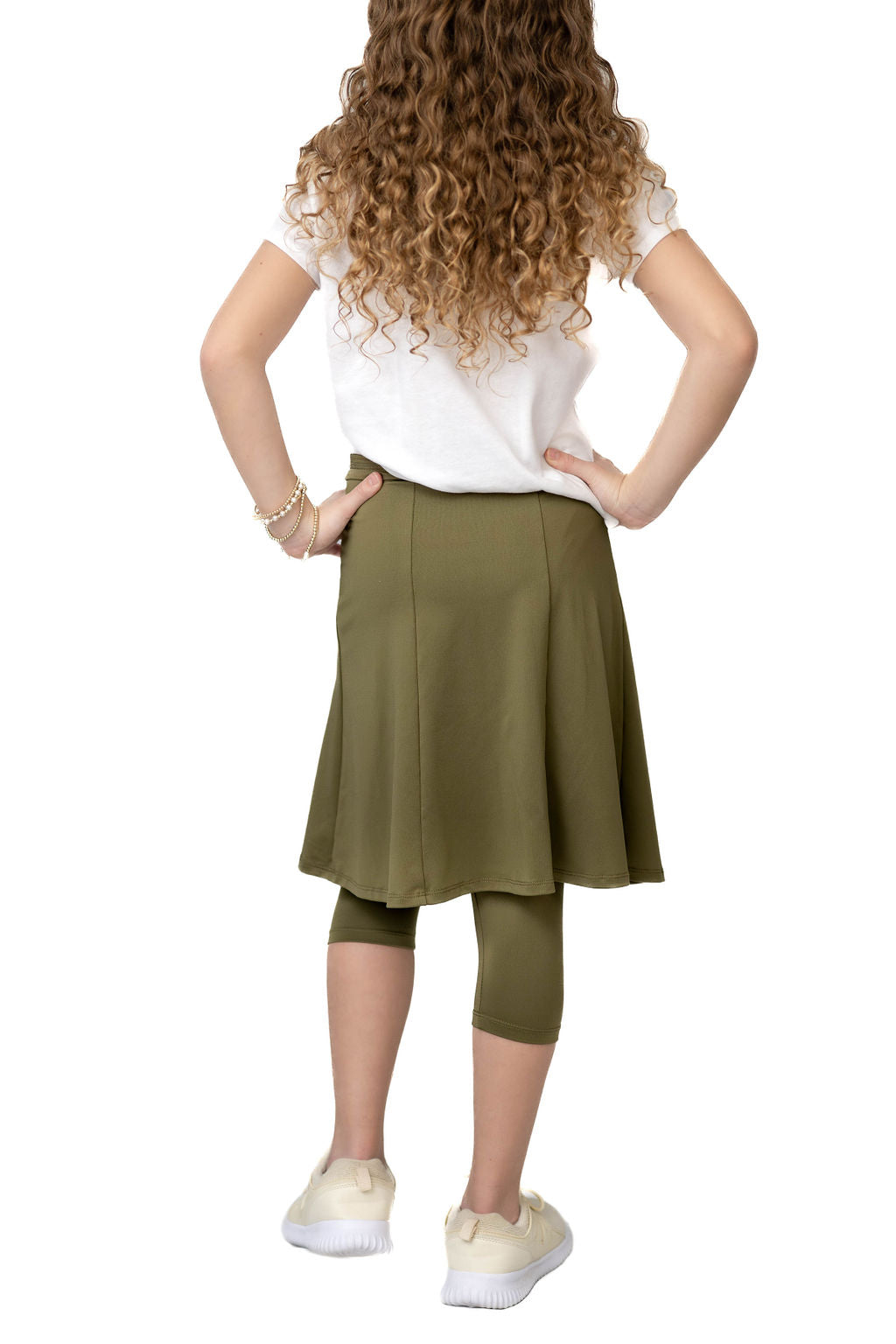 Girl wearing Snoga Athletics olive modest activewear skirt with attached leggings