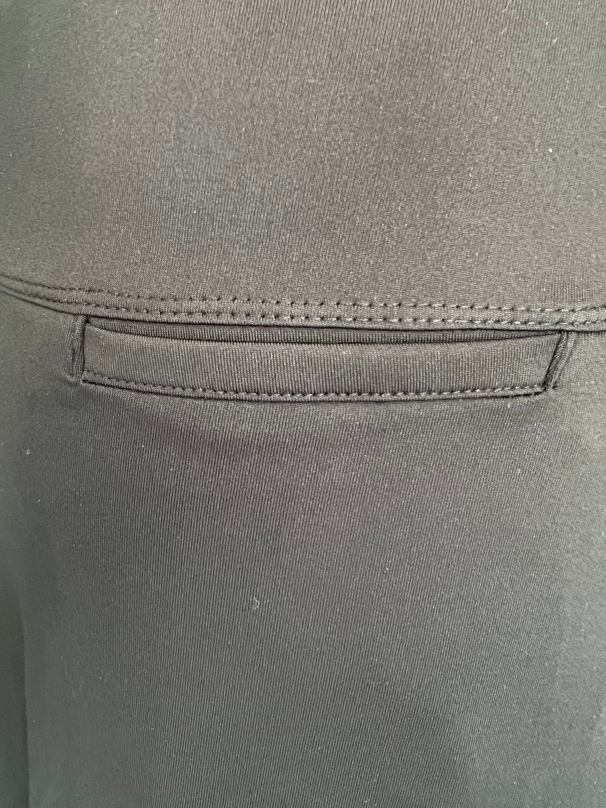 Close-up of black activewear fabric with pocket detail from Snoga Athletics