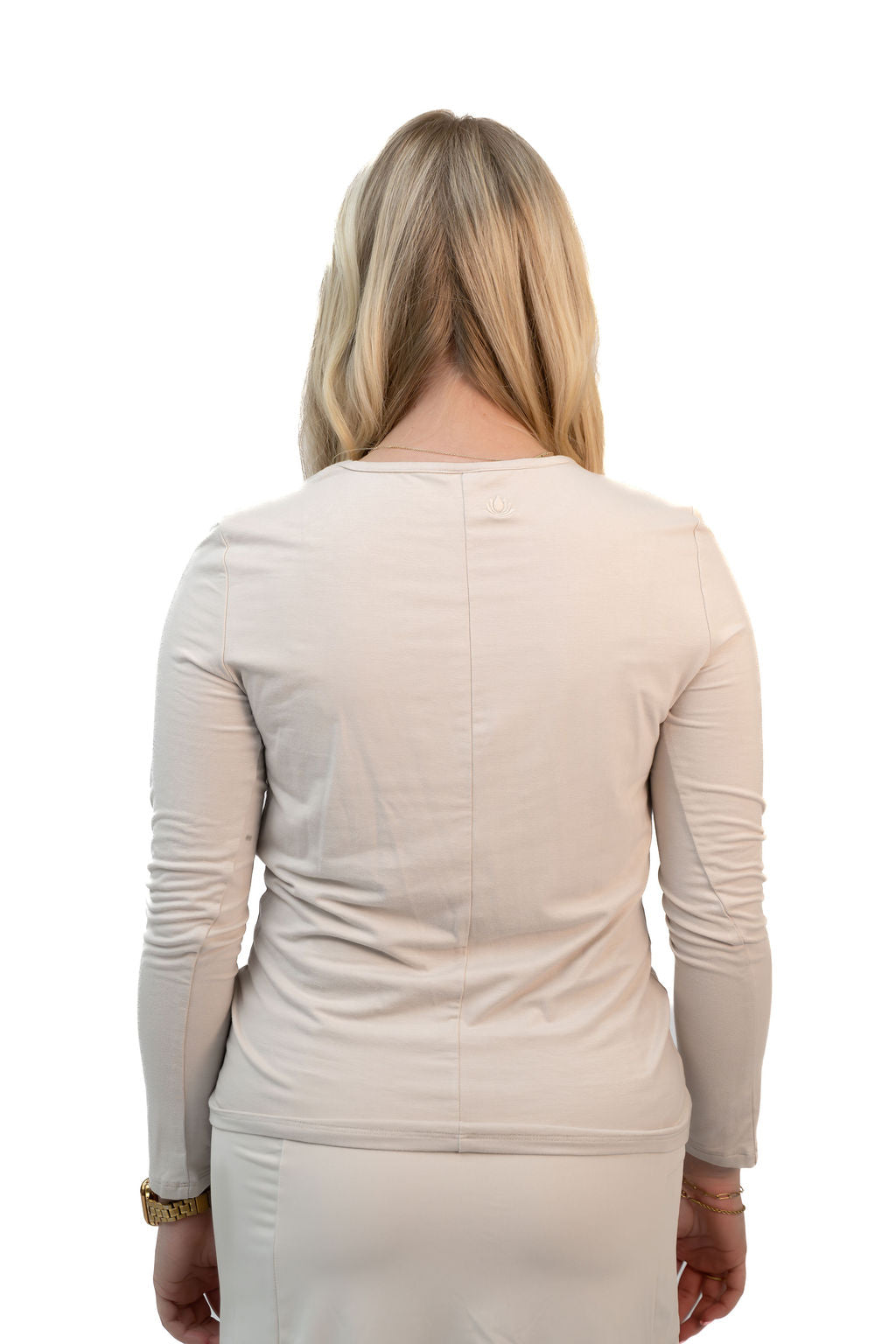 Snoga Athletics Twist Front Top in Moonbeam color, soft fabric, stylish design, shown on a model for casual or active wear.