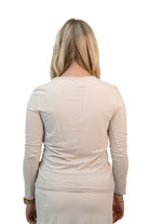 Snoga Athletics Twist Front Top in Moonbeam color, soft fabric, stylish design, shown on a model for casual or active wear.