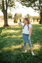 Girls Fit Snoga Denim by Snoga Athletics, kids' stretchy denim sports leggings, shown on a child in a natural pose.