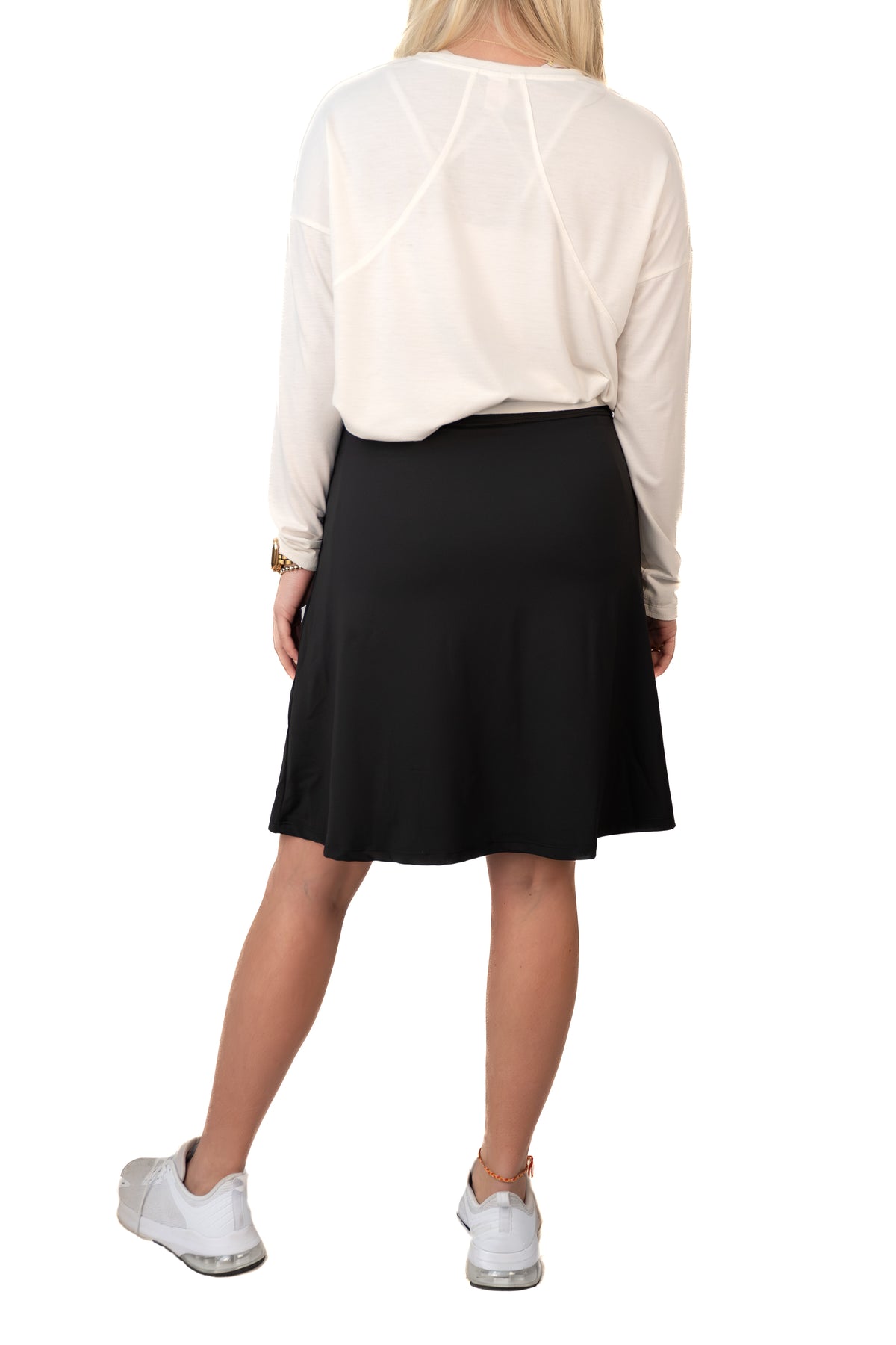 Black side pleat skort by Snoga Athletics, showing its stylish design and comfortable athletic fit suitable for active wear.
