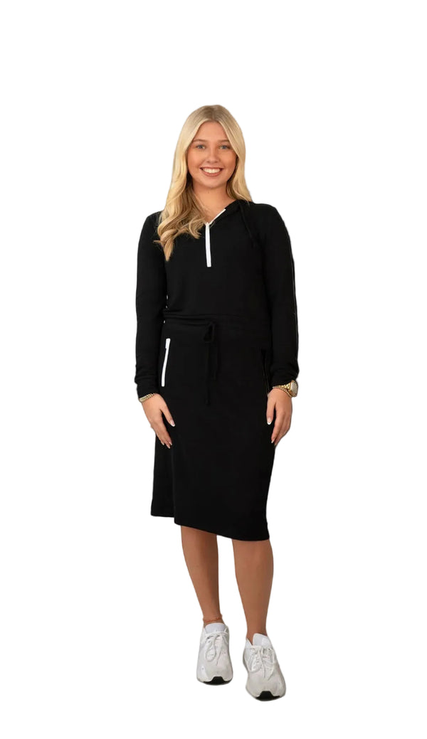 Woman modeling black modest athletic dress with white accents by Snoga Athletics
