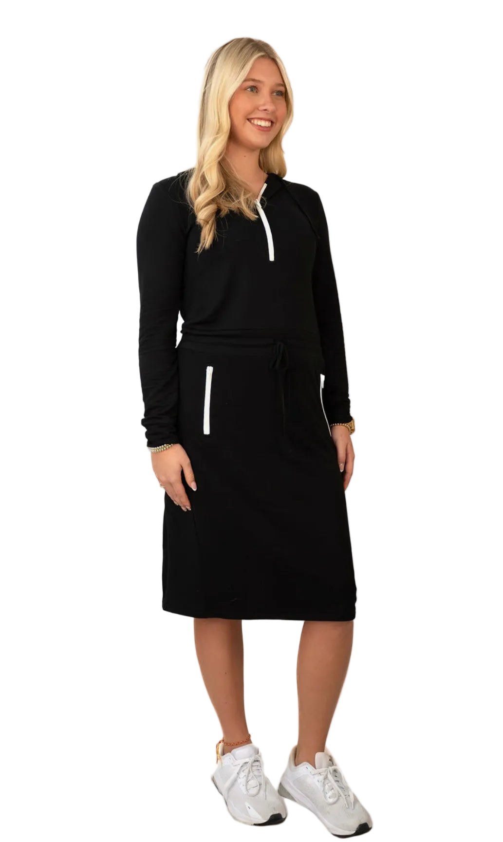 Woman wearing Snoga Athletics modest black activewear dress with white zipper details