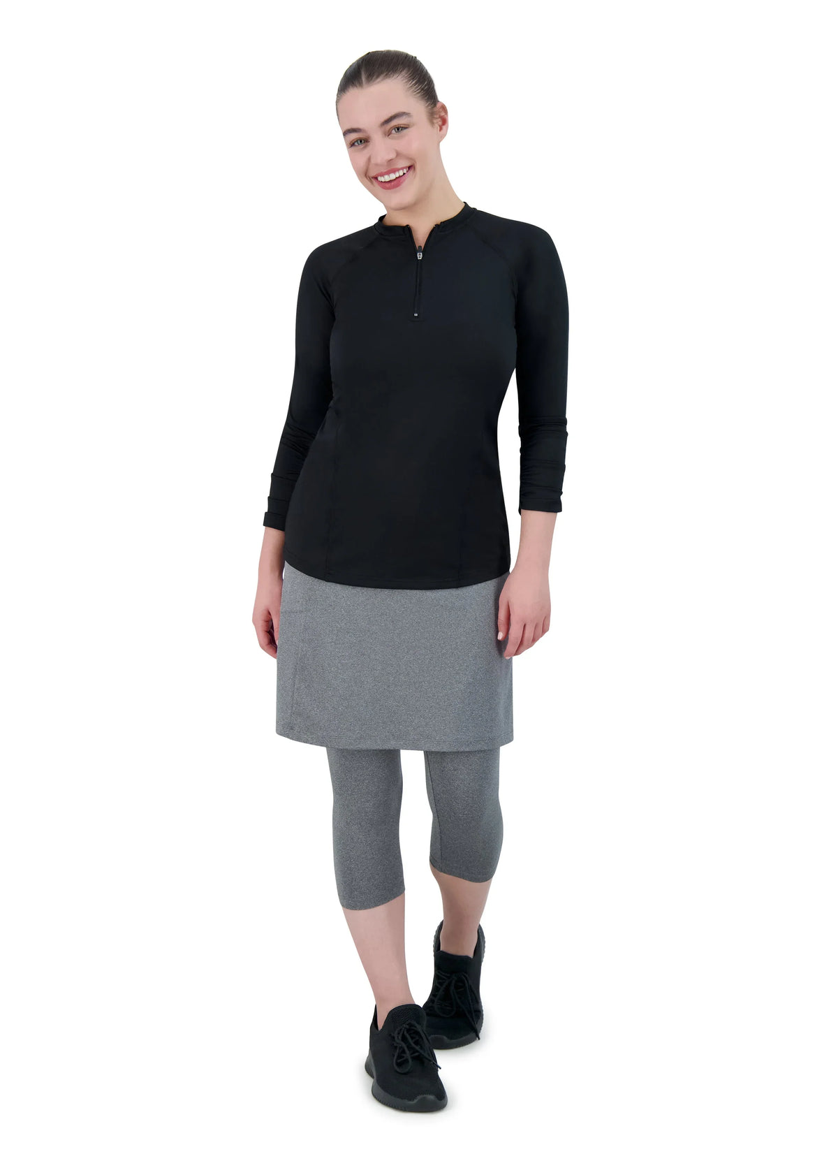 Woman modeling Snoga Athletics heather grey 3/4 length leggings with attached skirt