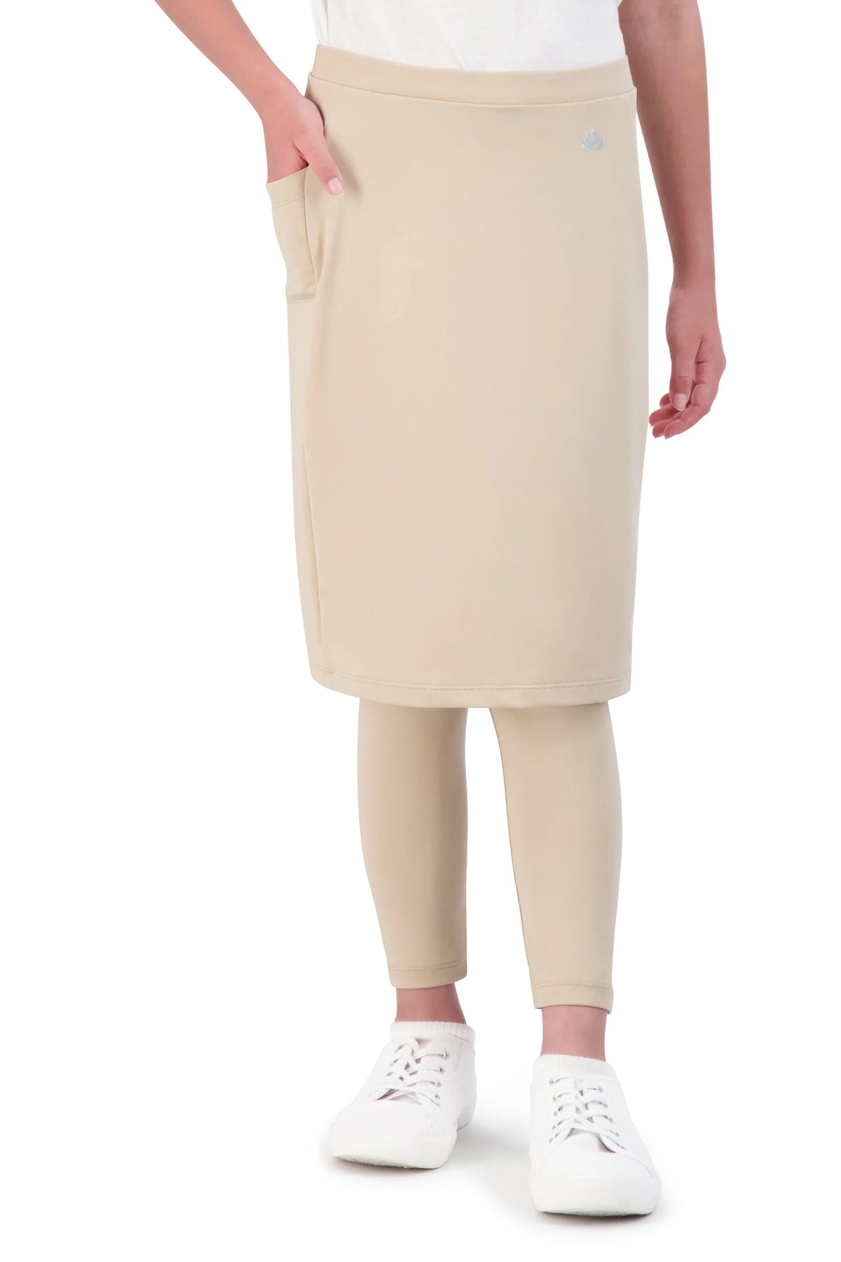 Girl wearing beige ankle-fit skirt leggings set by Snoga Athletics
