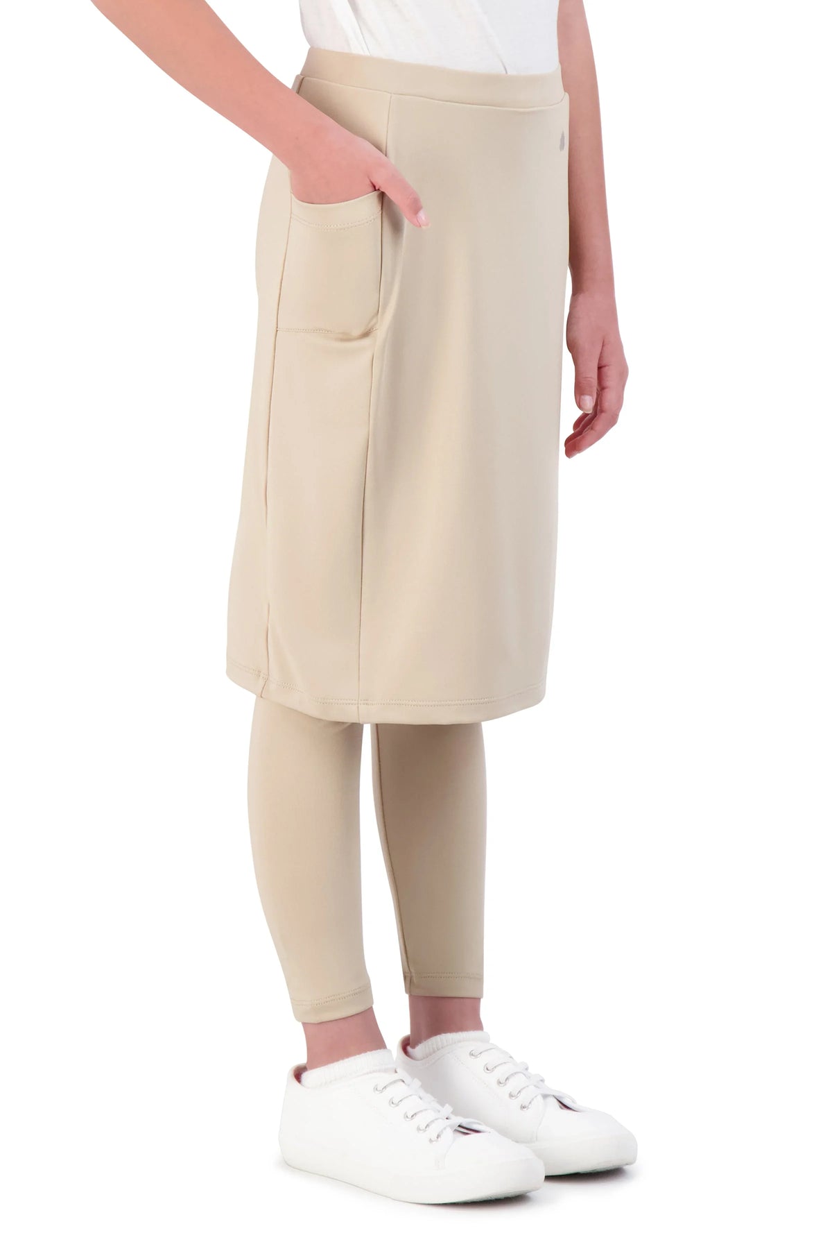 Girl wearing Snoga Athletics hummus beige ankle-fit skirt leggings with pockets