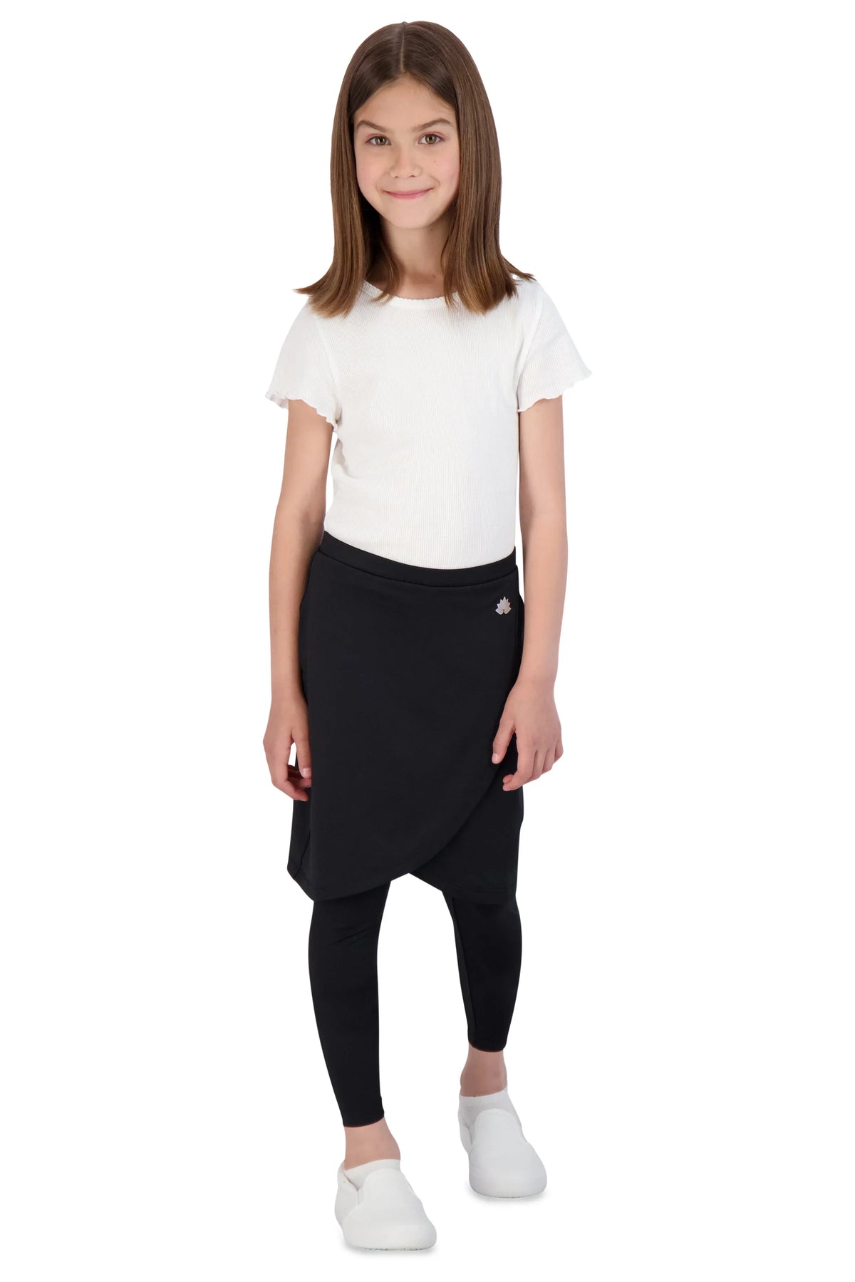 Girl wearing Snoga Athletics black faux wrap ankle skirt with leggings, white top, and sneakers
