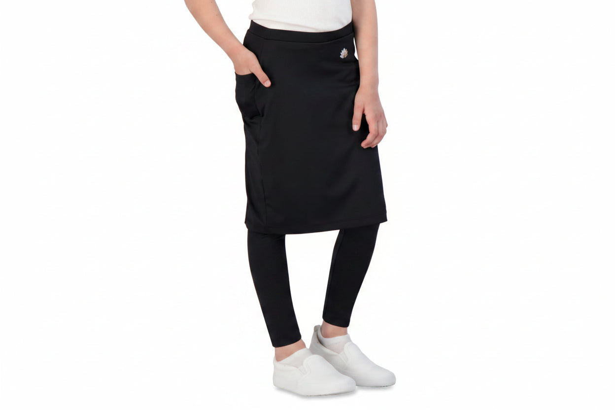 Snoga Athletics girls' black ankle-fit skirted leggings with side pockets and white slip-on shoes